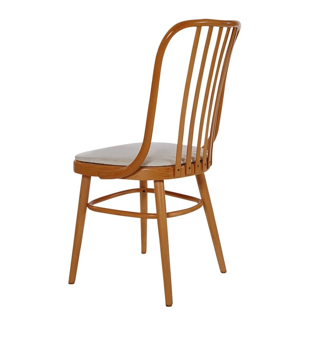 A handsome simply modern set of six dining chairs circa 1970s. Very much in the style of Michael Thonet. These feature solid maple construction with vinyl seat pads. Seats have some general wear, I would recommend recovering. Price includes set of