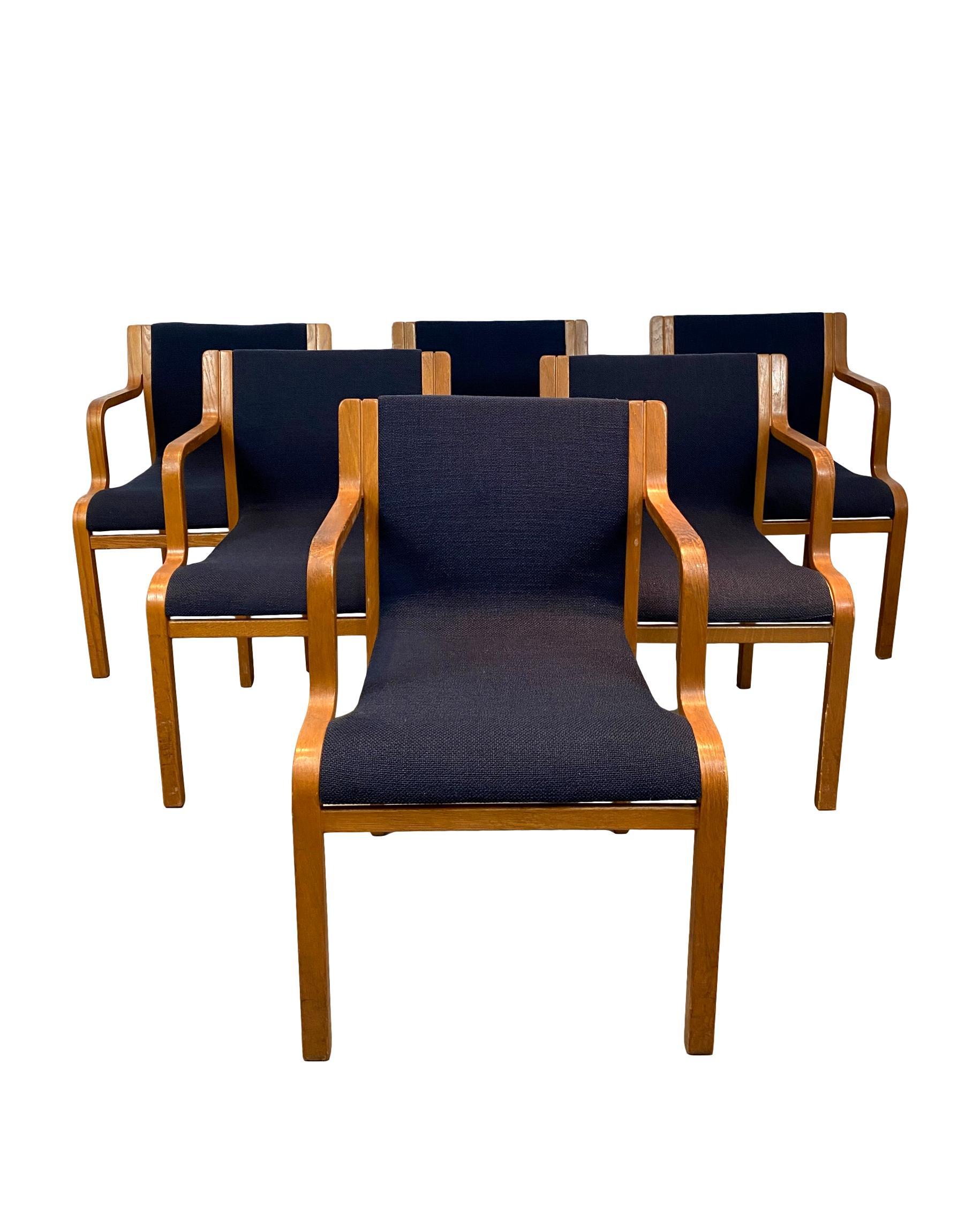 Set of six Mid-Century Modern Stendig stackable dining armchairs in beech, circa 1960, of bent and molded form, newly professionally reupholstered in period-appropriate Italian fabric.