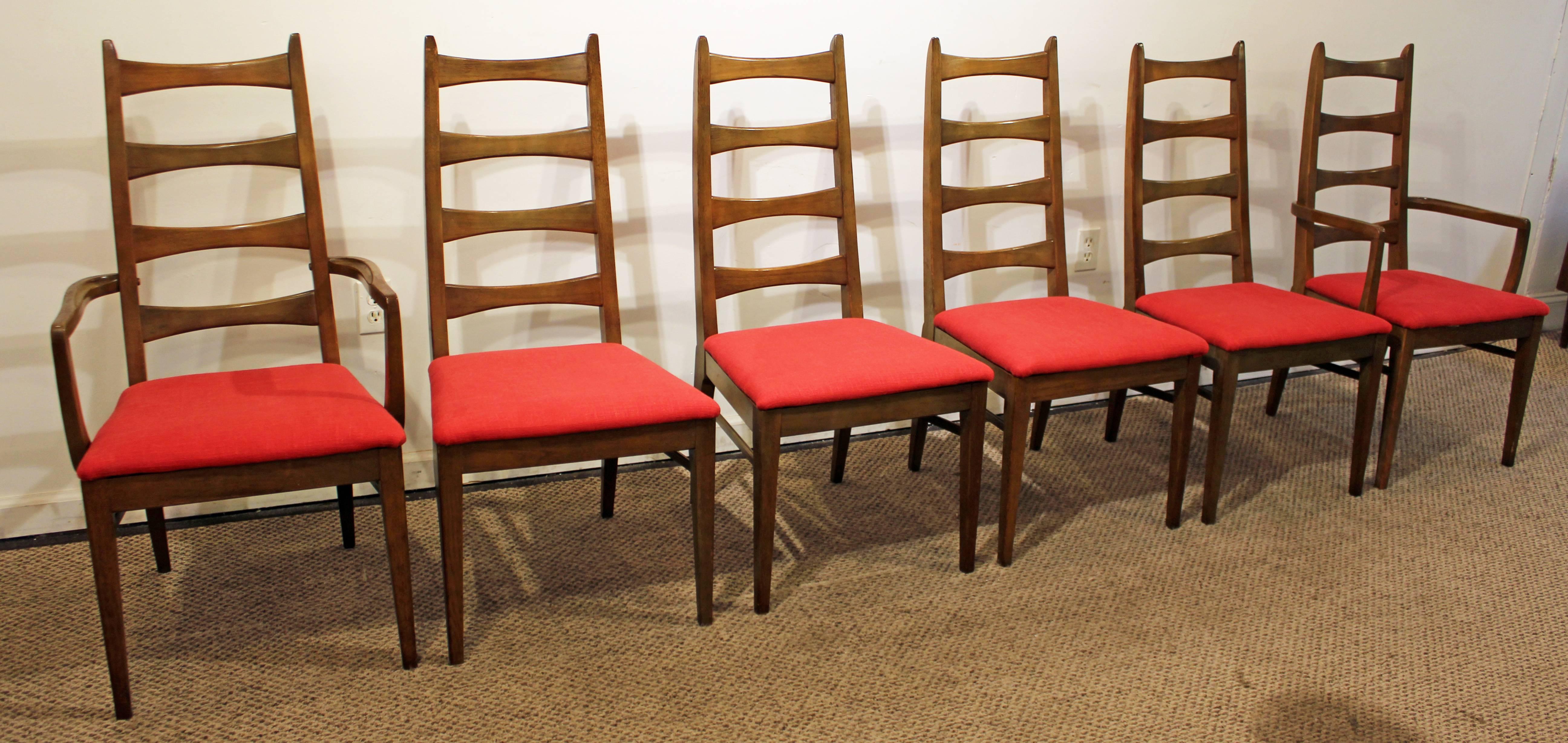 Offered is a set of six Mid-Century Modern dining chairs with bow tie backs. They are walnut and have been reupholstered with new red fabric. 

Approximate dimensions:
side chairs: 19.5
