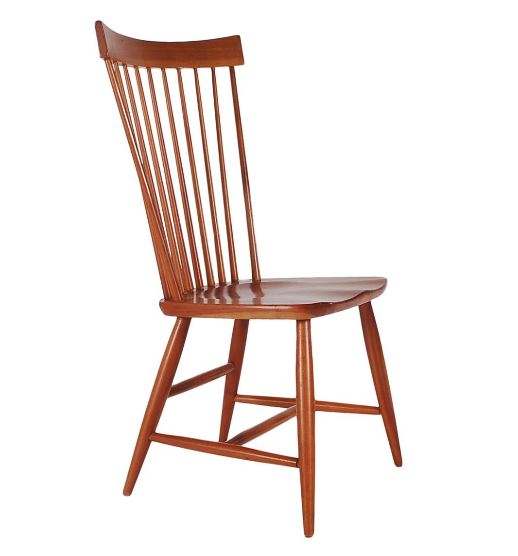 A well-made set of Windsor chairs in solid cherrywood. Great modern design lines, with saddle seats. Set of six as shown, 2 with arms, and 4 side chairs.

In the style of George Nakashima.