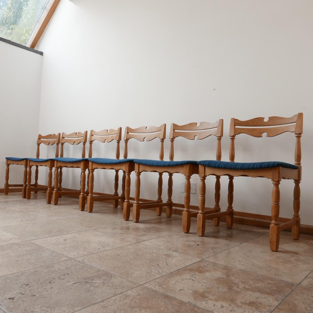 A set of stylish blonde oak dining chairs with echoes of Henning Kjaernulf,

Denmark, c1960s. 

A matching table available on a separate listing at the time of listing.

In very good condition. 

Original upholstery remains in good condition