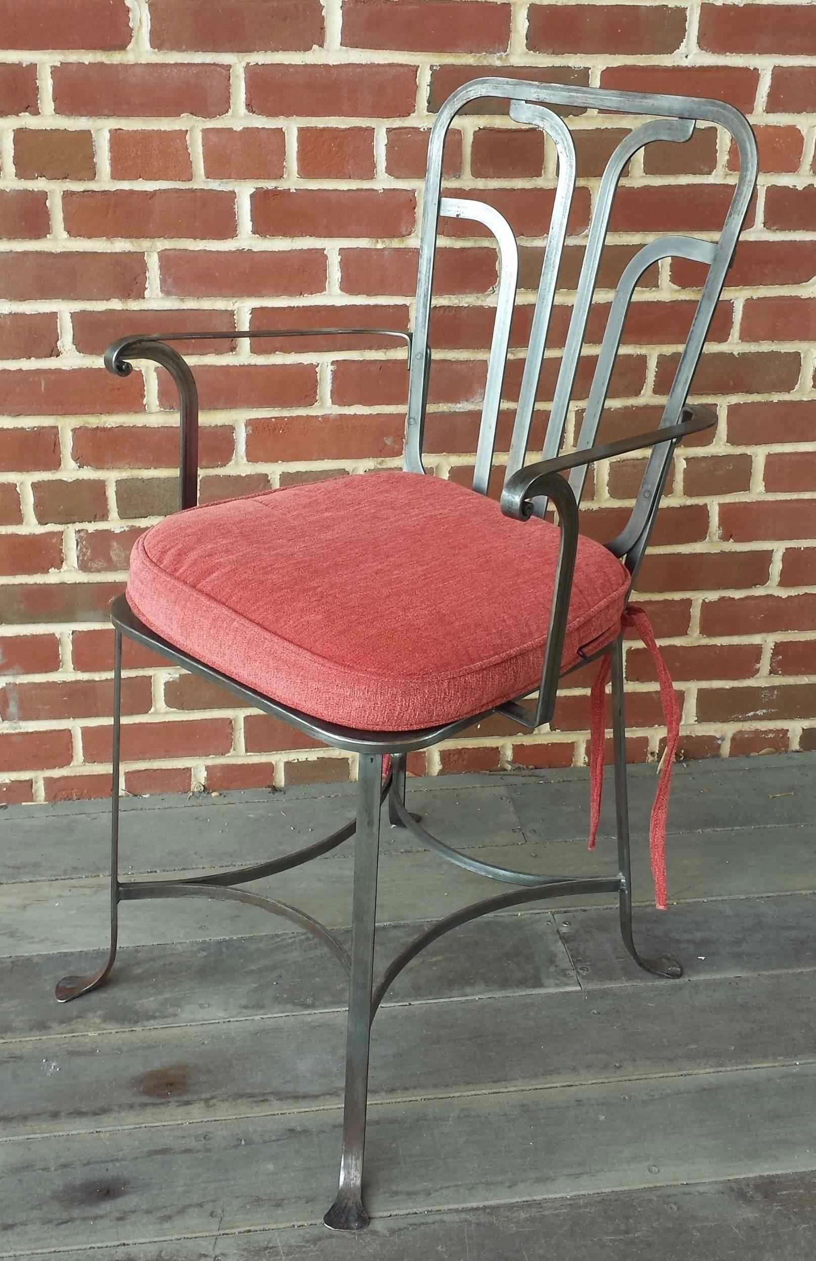 Set of six midcentury polished steel Italian armchairs. Good proportions with finely sculpted arms over woven seats and curved stretchers. Comfortable, sturdy and great for your covered outdoor dining space. Cushions included.
Italy, circa