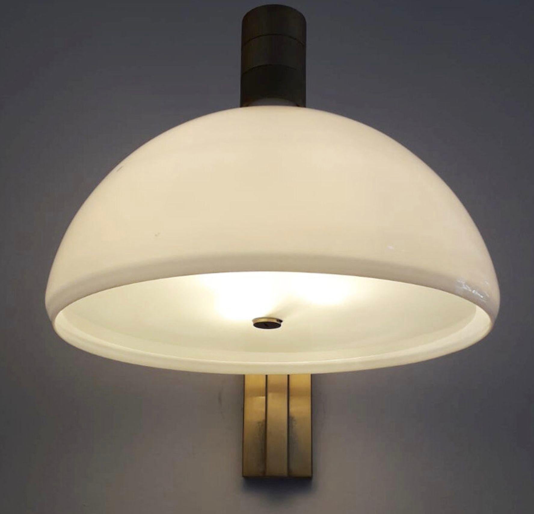 Original set of six mid-century Italian sconces/wall lights designed by Franco Albini, Franca Helg and Antonio Piva manufactured by Sirrah with large opaline white glass shades mounted on brass frames / Made in Italy, 1960's.
Measures: height 17