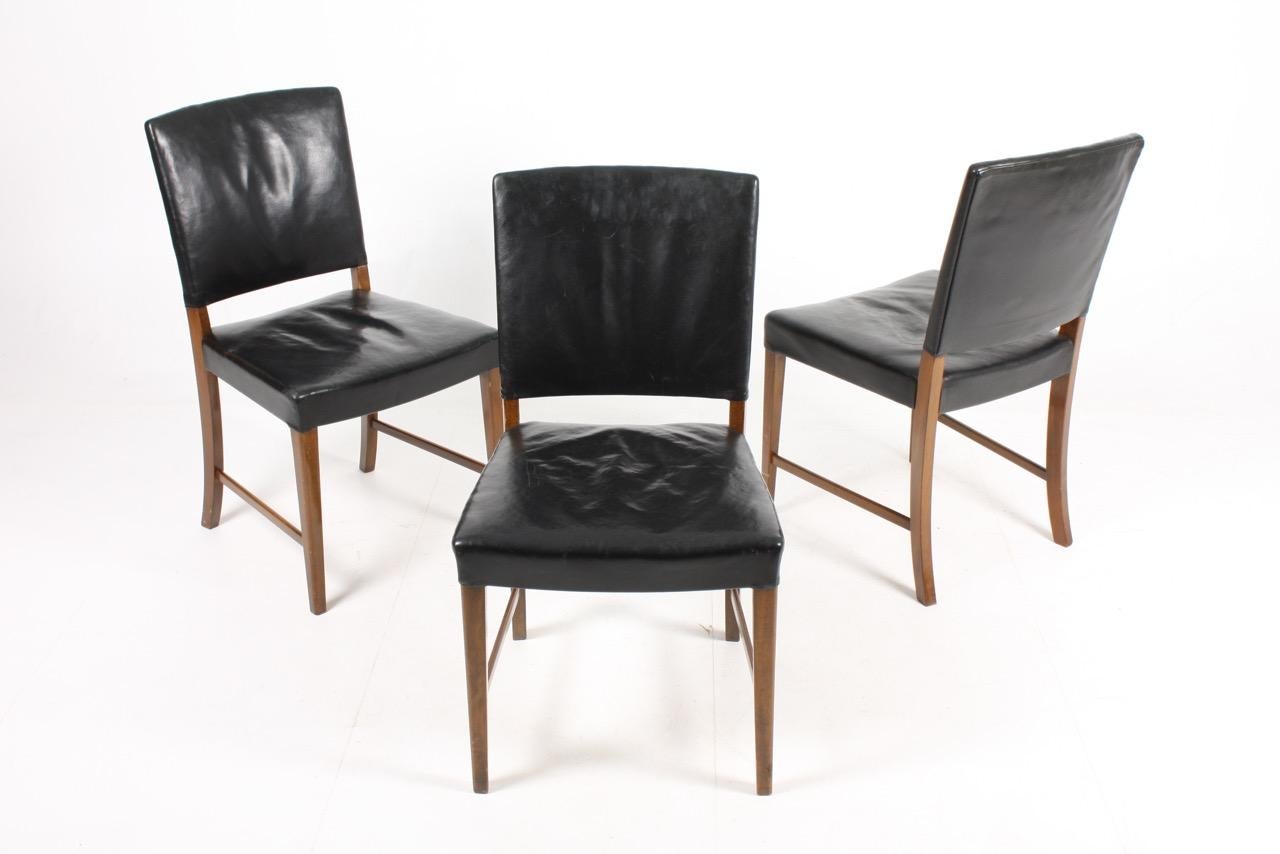 Set of six side chairs in patinated leather on a solid beech frame. Made in Denmark in the 1940s.