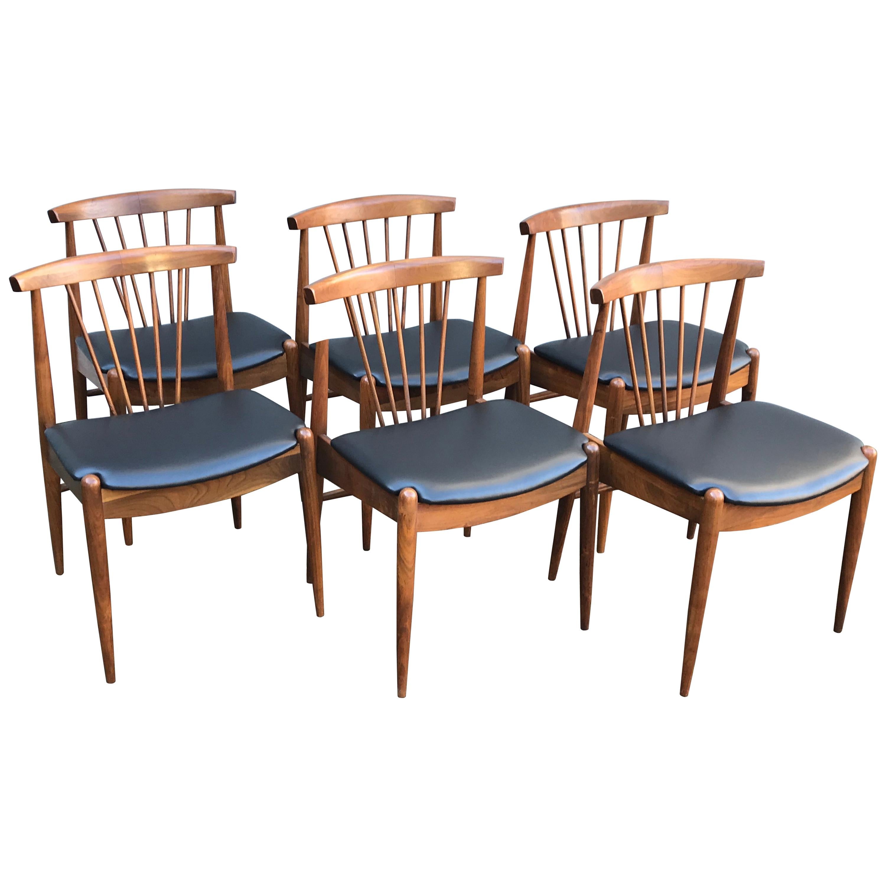 Set of Six Mid Century Walnut Spindle Back Dining Chairs with Black Vinyl Seats