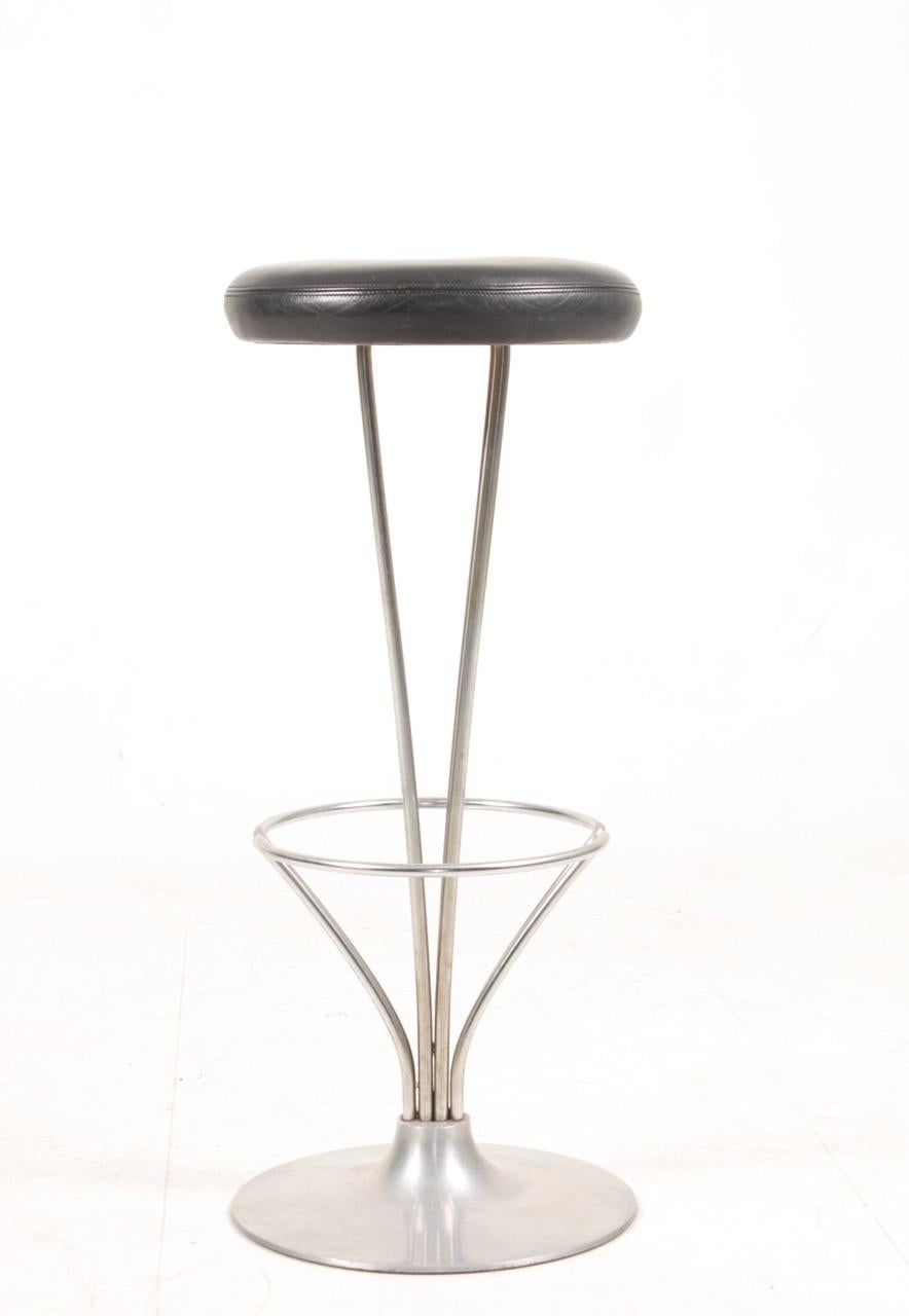 Set of six of high stools in metal with patinated leather seats. Designed by Piet Hein for Fritz Hansen. Made in Denmark, great condition. Ideal for the kitchen or in a bar.