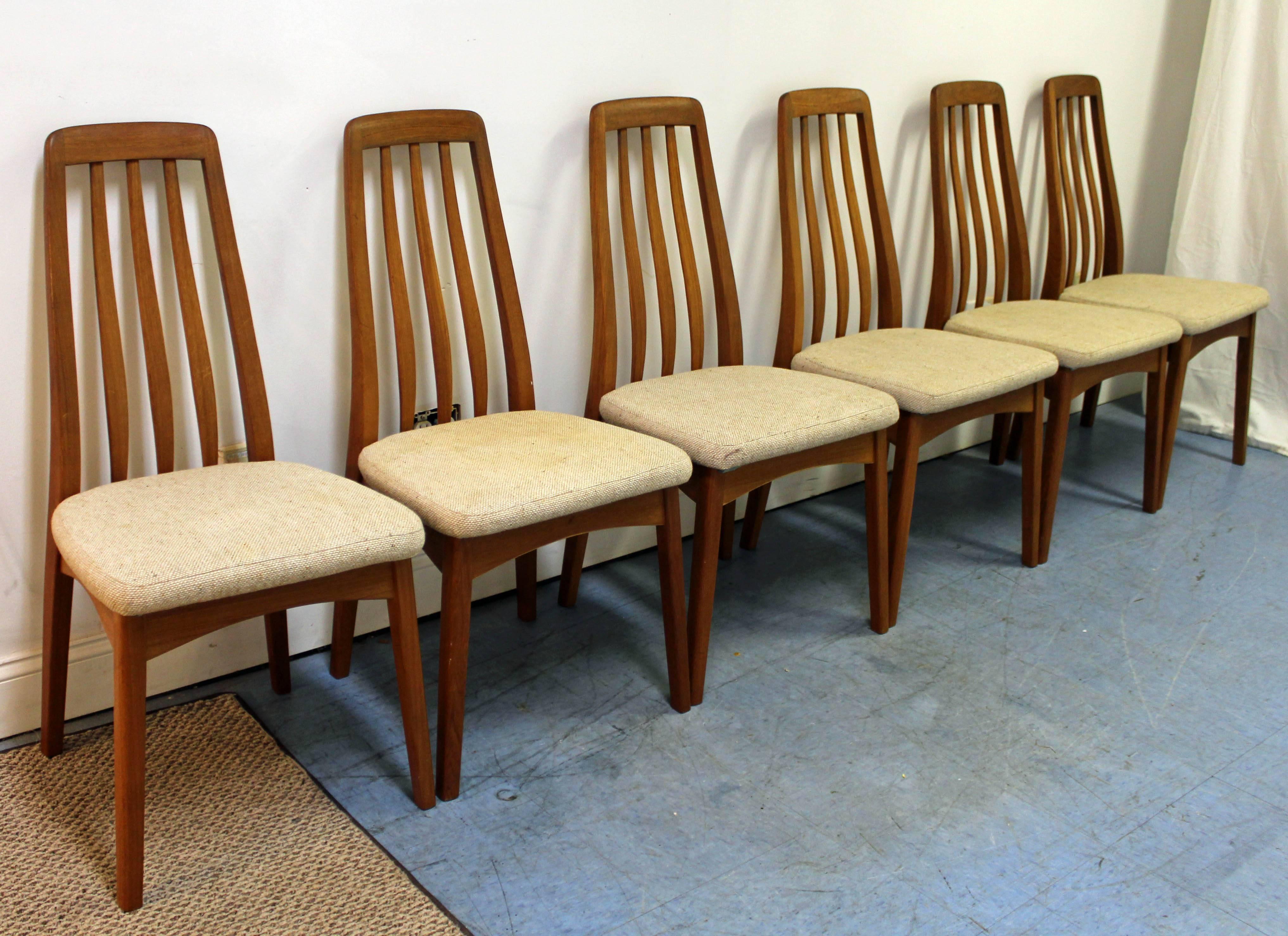 Offered is a set of six Danish modern teak dining chairs. Includes six side chairs with spindle-backs. The chairs are very sturdy. They are not signed. 

Dimensions: 
18
