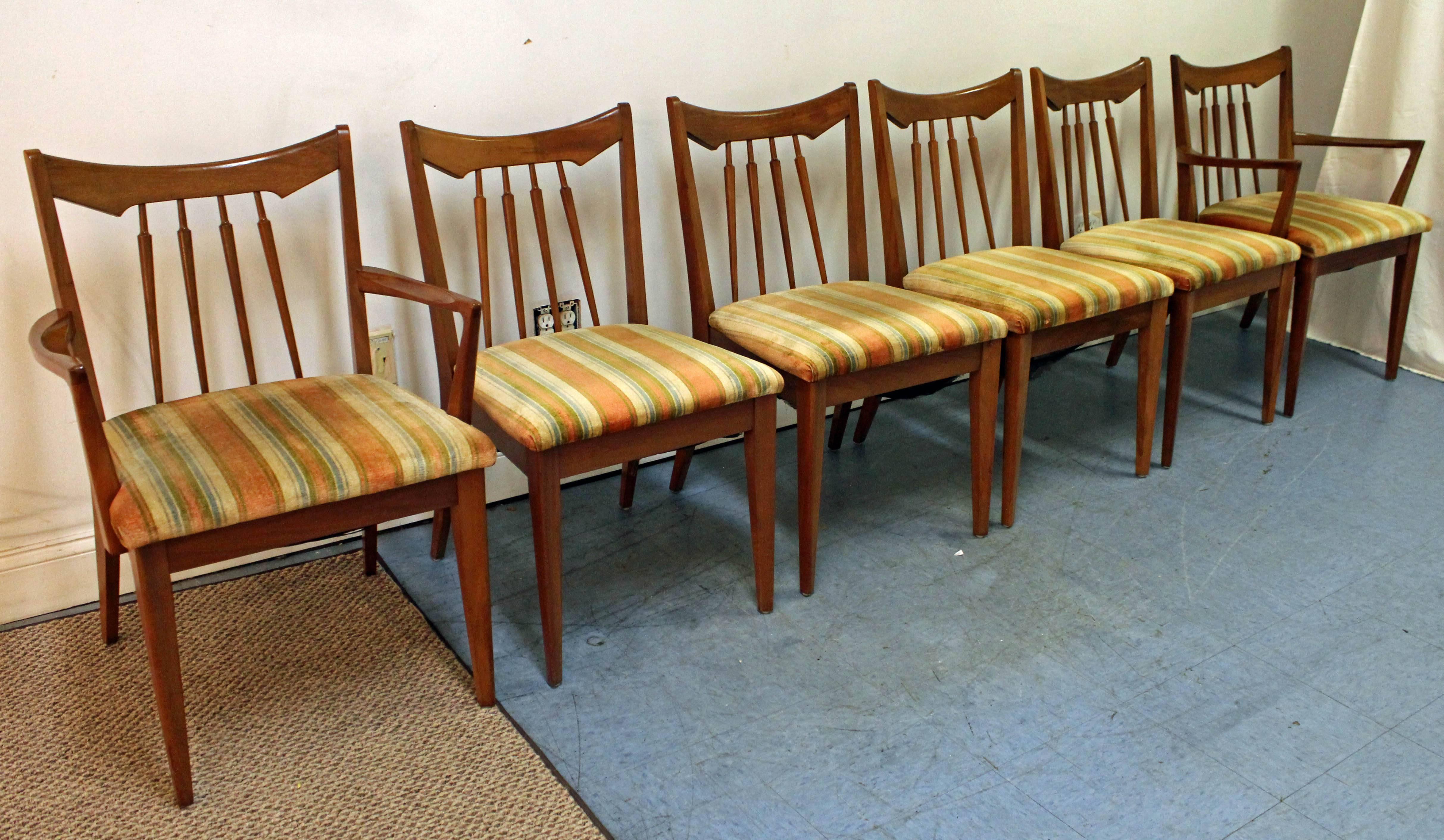 What a find. Offered is a Mid-Century Modern set of six dining chairs. This set includes four side chairs and two armchairs that are made of walnut with upholstered seats up. They are in decent condition, need to be reupholstered (some stains/tears