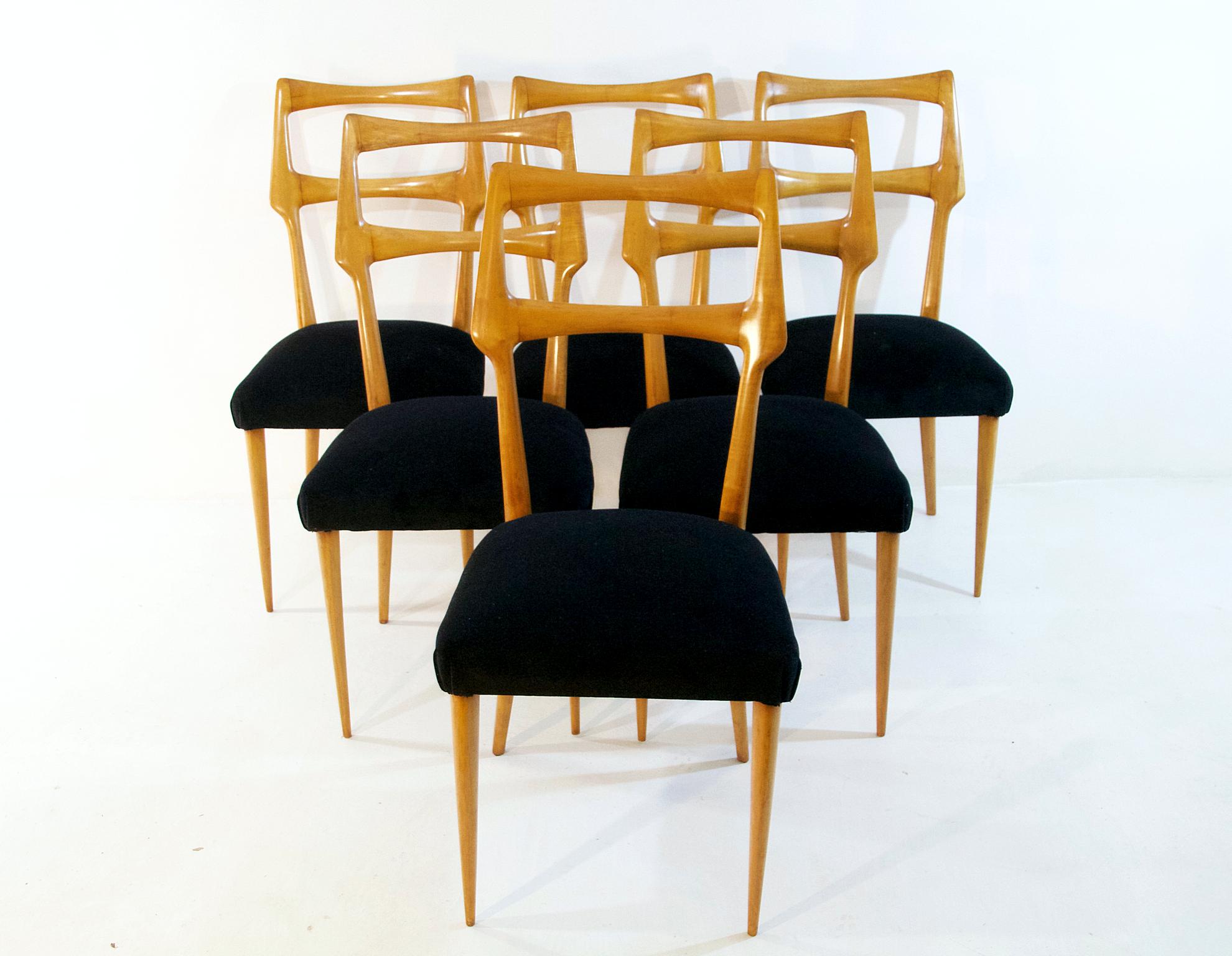 A set of six Italian dining chairs with a sublime organic design in maple attributed to Augusto Romano and re-upholstered in black velvet. The chairs have supreme craftsmanship and are in great condition. Very comfortable for long dinner