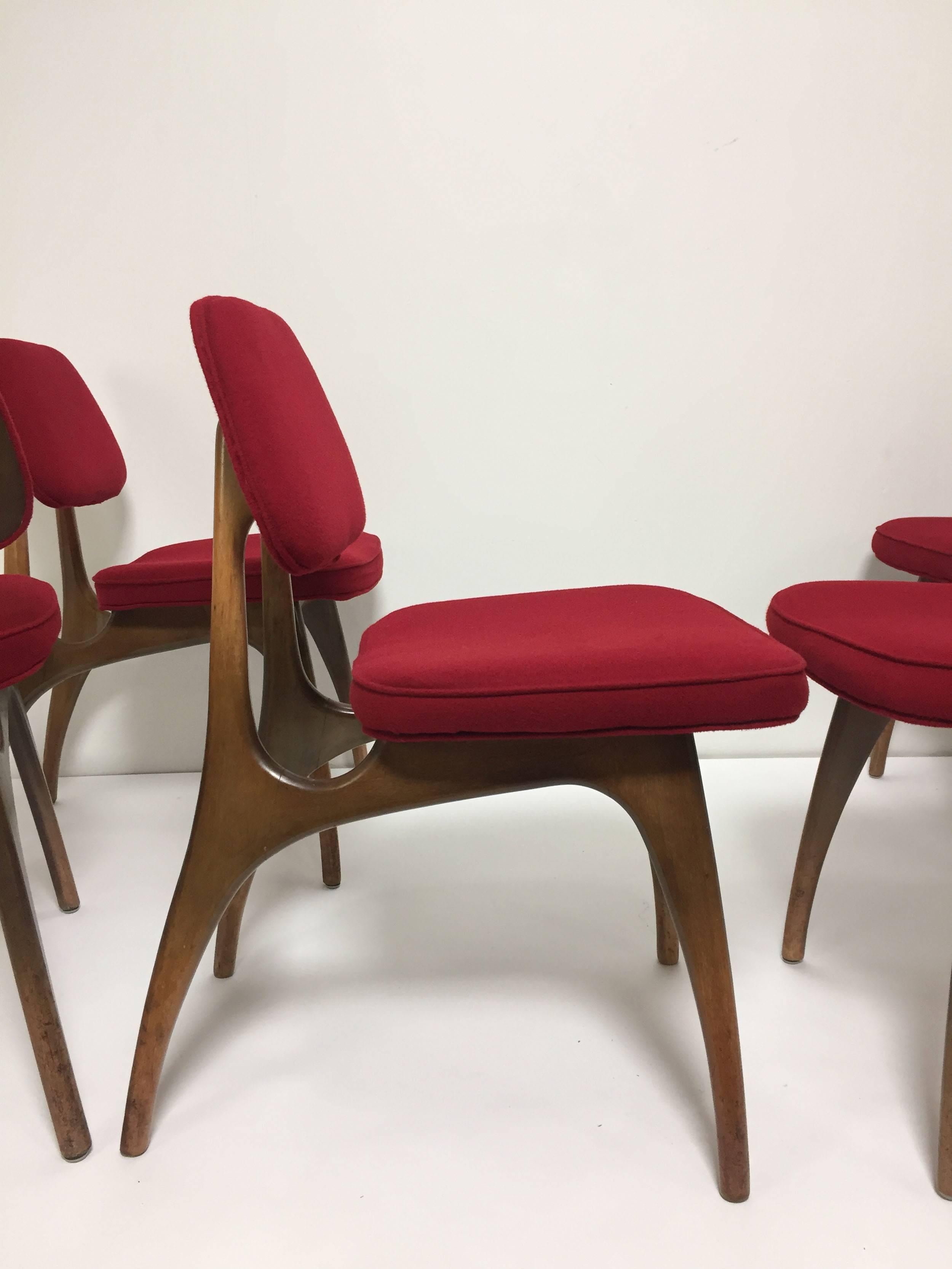 Set of six midcentury dining chairs with gracefully arched gazelle style legs.