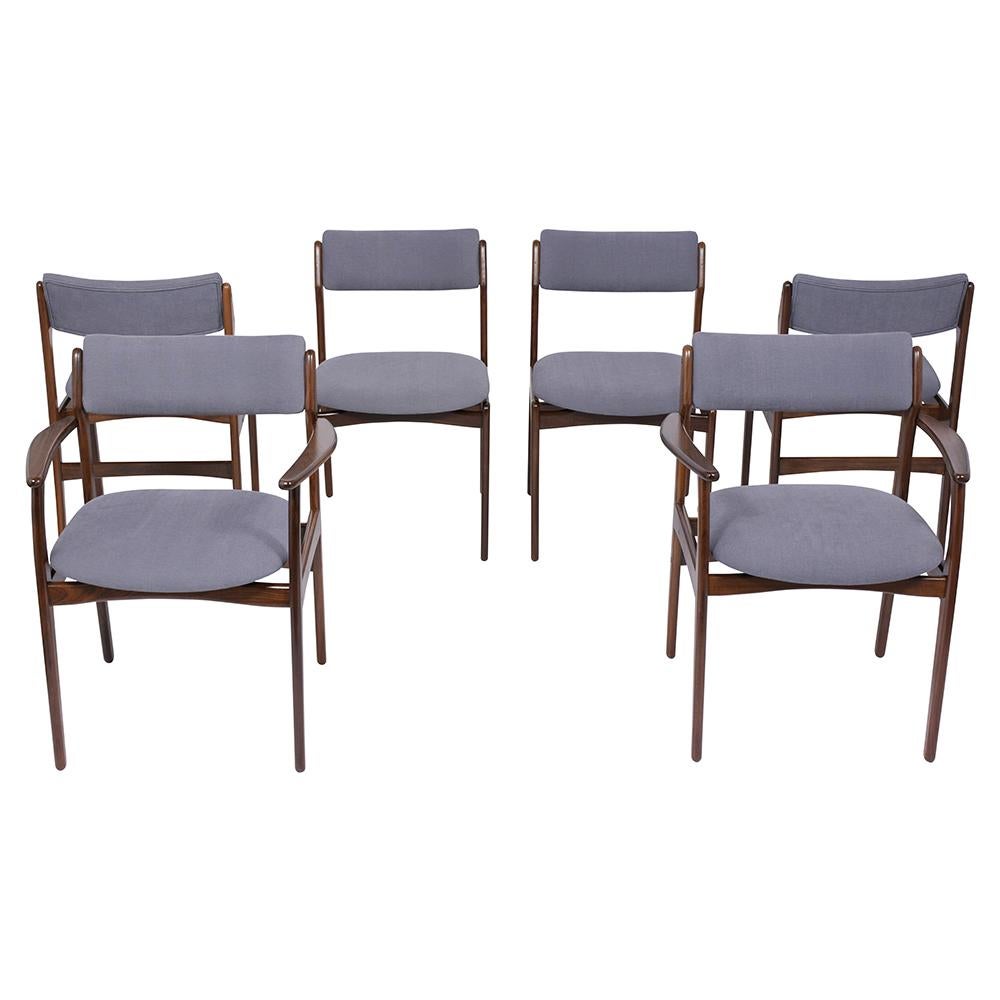 A Fabulous Set of six danish dining chairs hand-crafted out of teak wood with a sleek design and new walnut color with a lacquer finish. This set features two armchairs & four side chairs with carved frames, and back/seat rests are newly upholstered