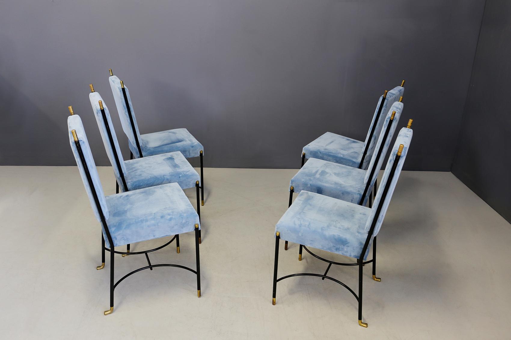 Elegant set of six Bertrand chairs from 1950 Paris. The chairs are made of black lacquered wrought iron and brass tips. The backrest and seat have been restored in a beautiful blue-blue velvet. The peculiarity of this seat are the brass tips and the