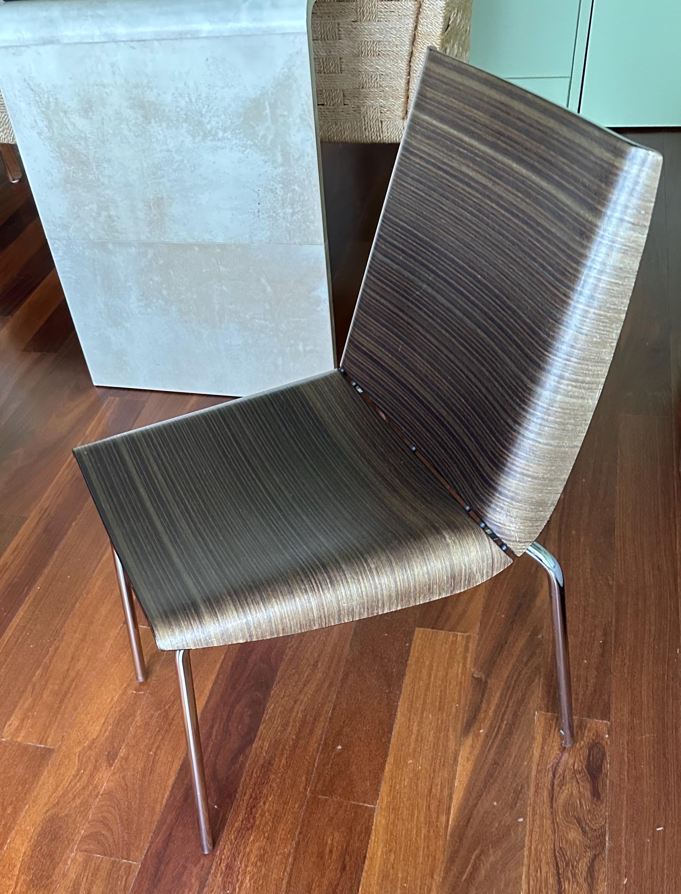 This set of six modernist bent plywood chairs with chrome tubular legs were designed by Biagio Cisotti, Sandra Laube for Italian firm Plank have zebra wood design in the wood. Etched 