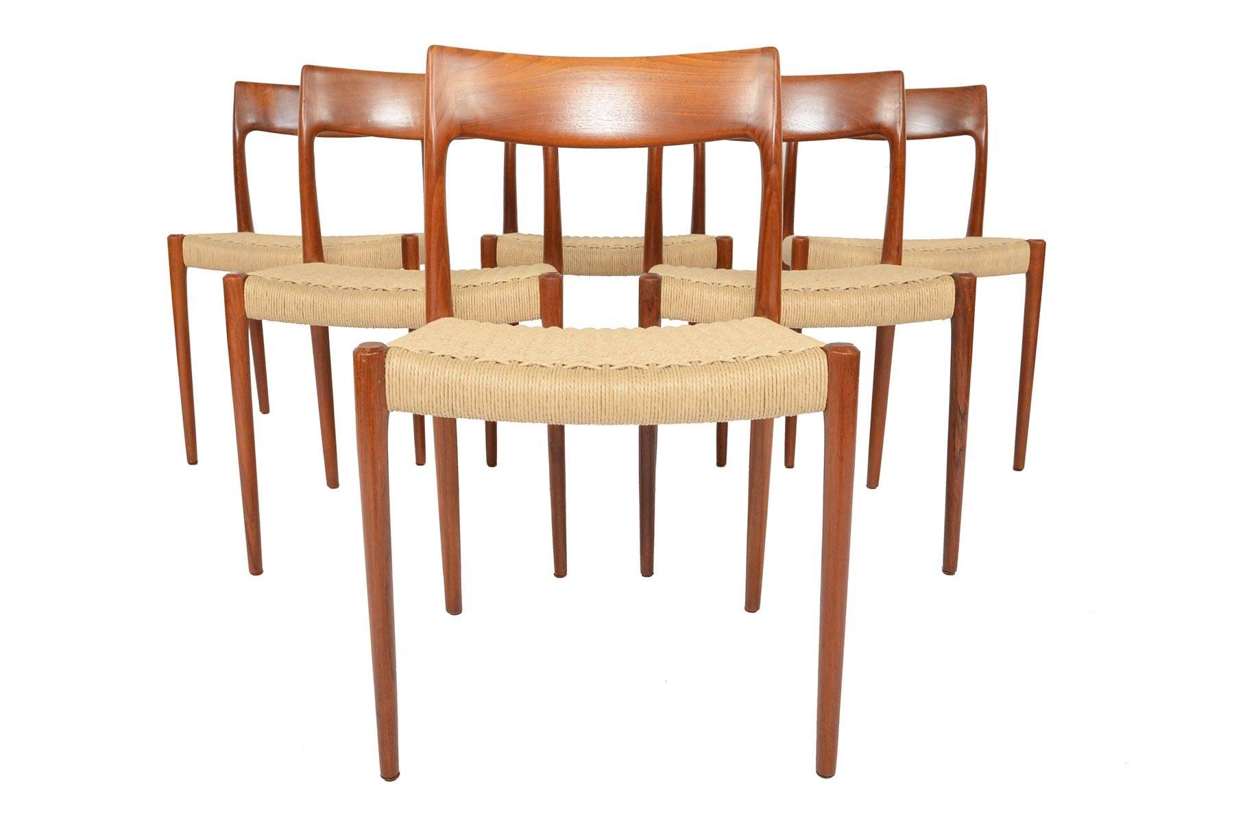 This set of six Møller model 77 dining chairs in teak are a rare find. Designed in 1959 by Niels Otto Møller for J.L. Møller, this set is crafted in solid teak. Chairs not only boast superior craftsmanship throughout, but a traditional hand crafted