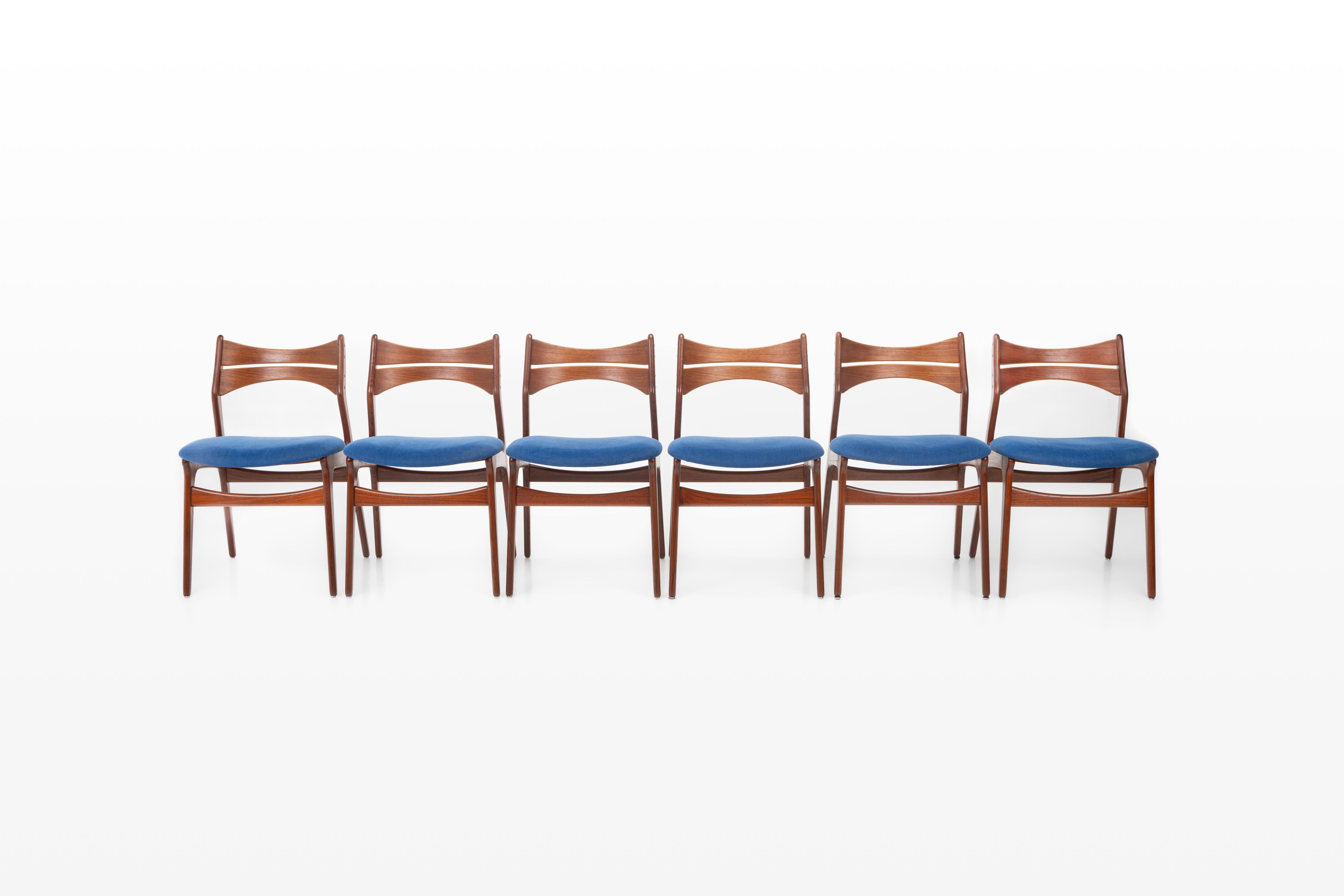 Set of six 'Model 310' dining chairs designed by Erik Buch for Christian Christensen Møbelfabrik, Denmark 1960s. The chairs have a teak frame and have a blue fabric seat.

Dimensions:
W: 50 cm
D: 52 cm
H: 82 cm