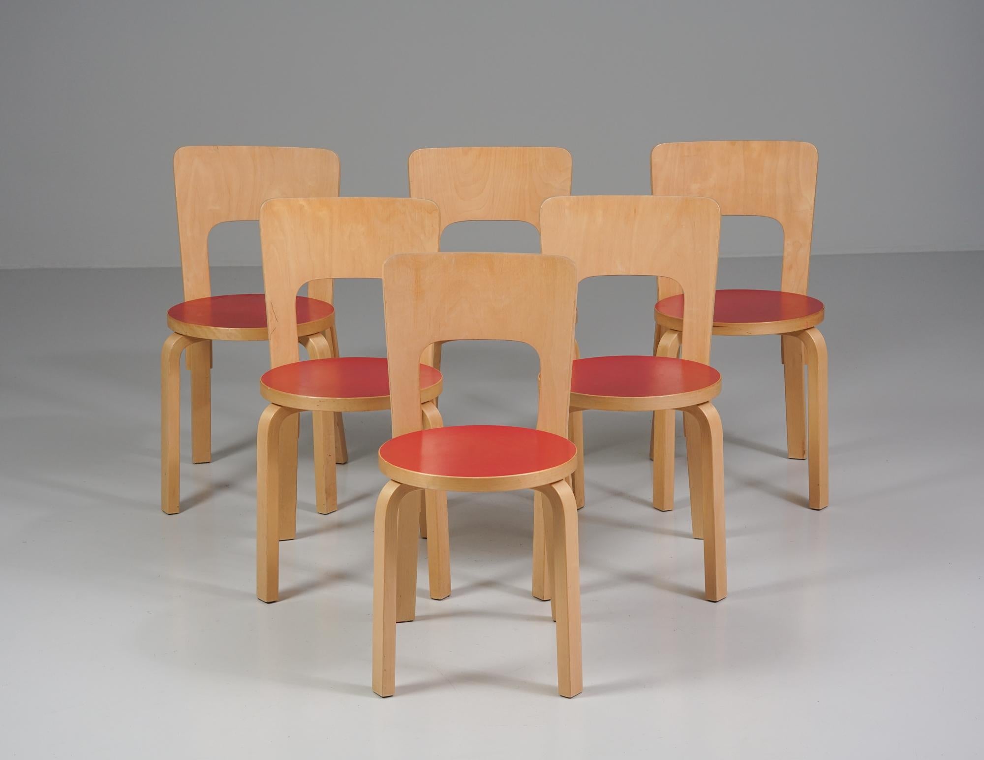 Set of six model 66 chairs, designed by Alvar Aalto, manufactured by Artek, 1960s. Birch frame with linoleum seats. Good vintage condition, patina and minor wear consistent with age and use. The chairs are sold together as a set. 

Alvar Aalto