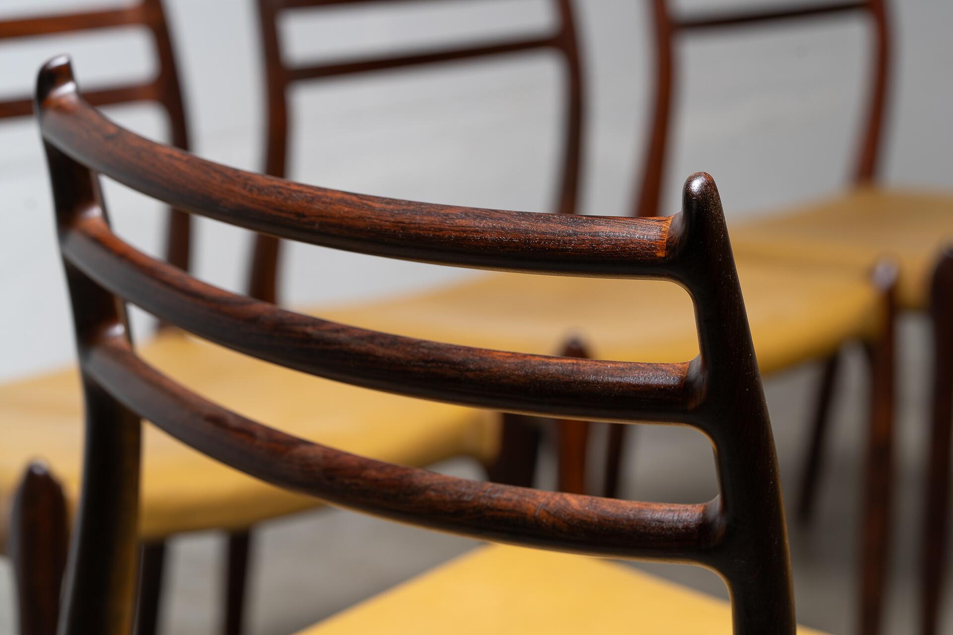 Crafted in the 1960s by Danish master Niels Otto Møller for J.L. Møllers Møbelfabrik, this rare set of six Model 78 side chairs is among the most coveted designs of the Danish modern era. Sculptural, refined, and effortlessly elegant, these chairs
