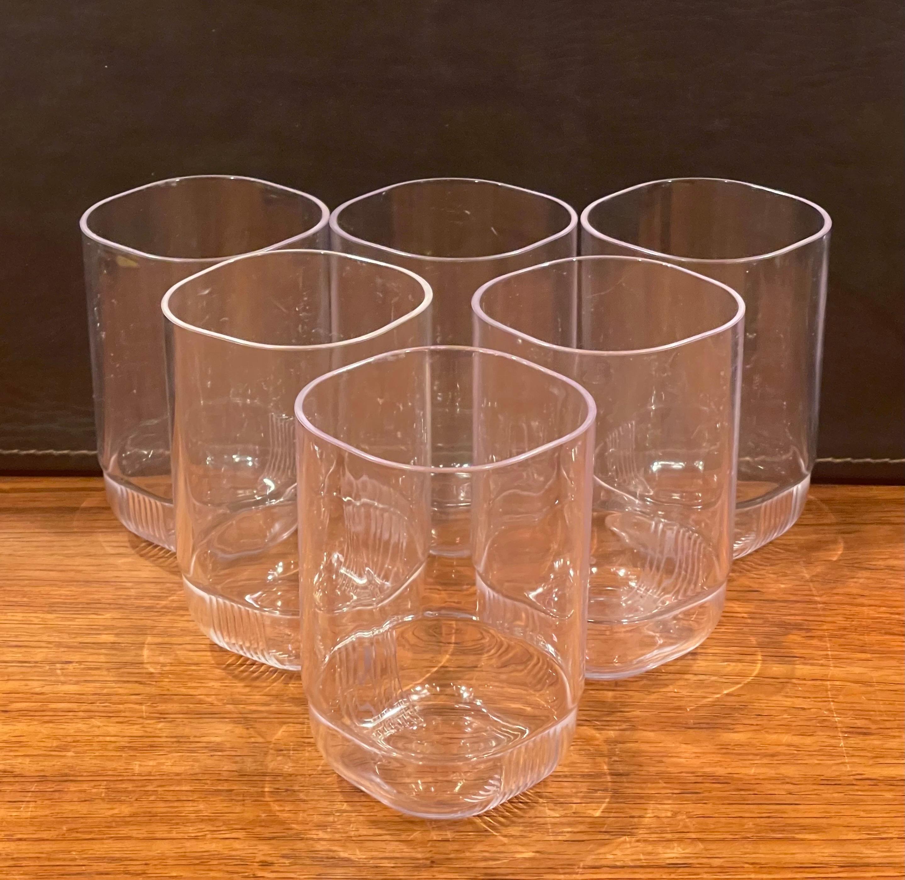 Very functional and cool set of six modern lucite drinking glasses by Guzzini of Italy, circa 1980s. The glasses are in very good condition and each piece measures 3 W x 3
