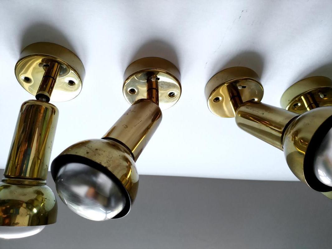 Set of six modernist adjustable brass ceiling or wall spot lights flush mounts.
Germany, 1960s-1970s.


 