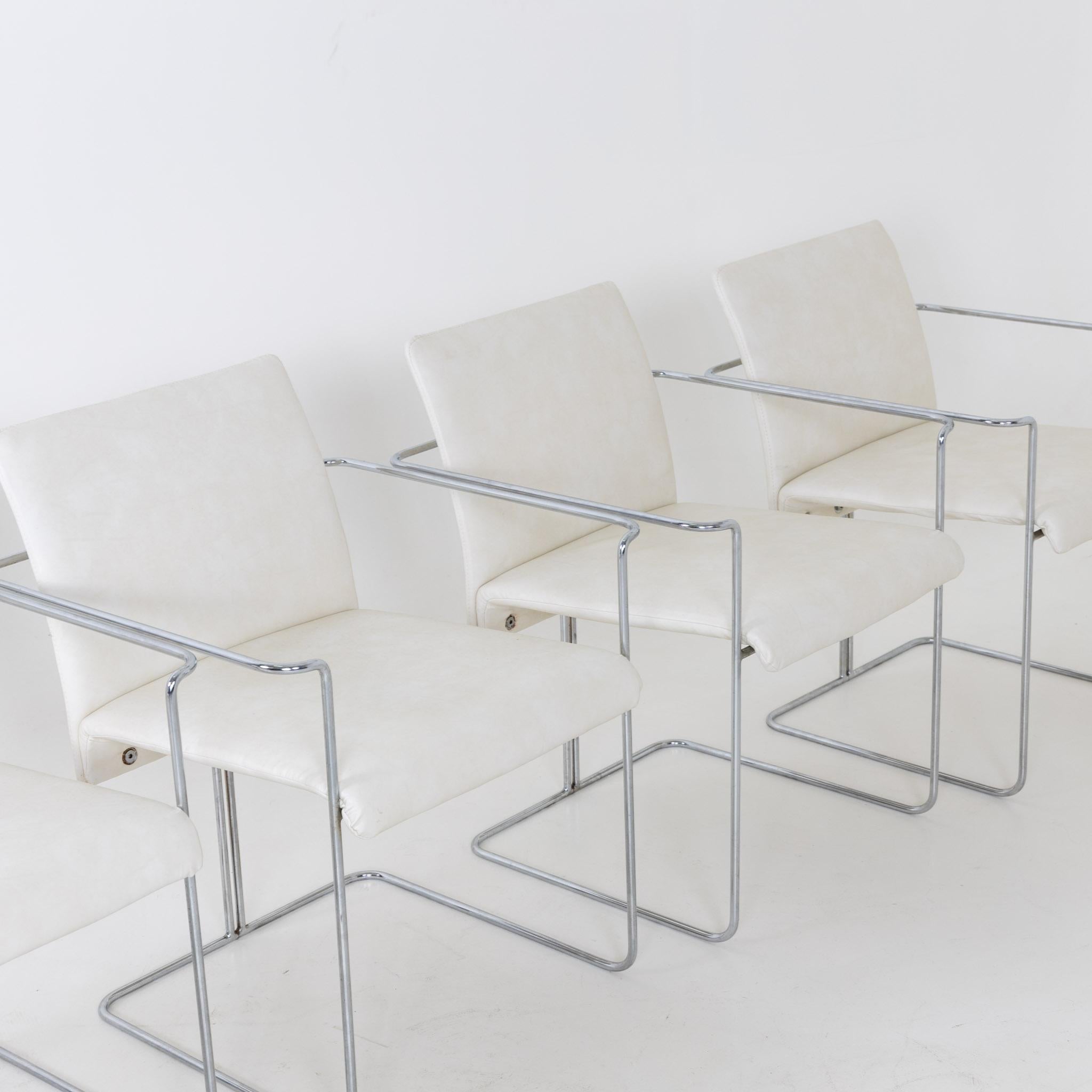 Set of six Modernist dining chairs by Ernesto Radaelli. 
Chrome plated steel frames and leather upholstered seats.