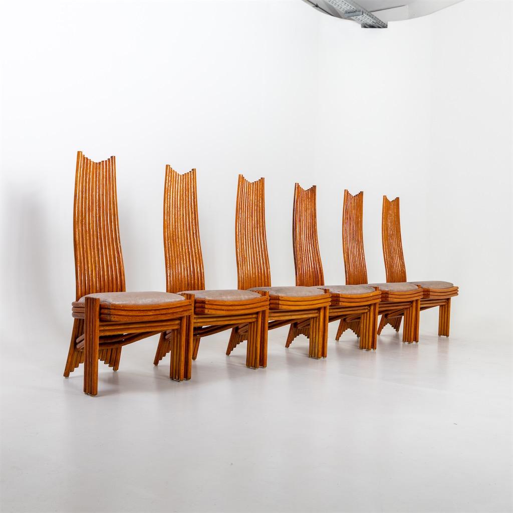 A set of six tall back Modernist dining chairs. 
Stained bamboo with upholstered seats.