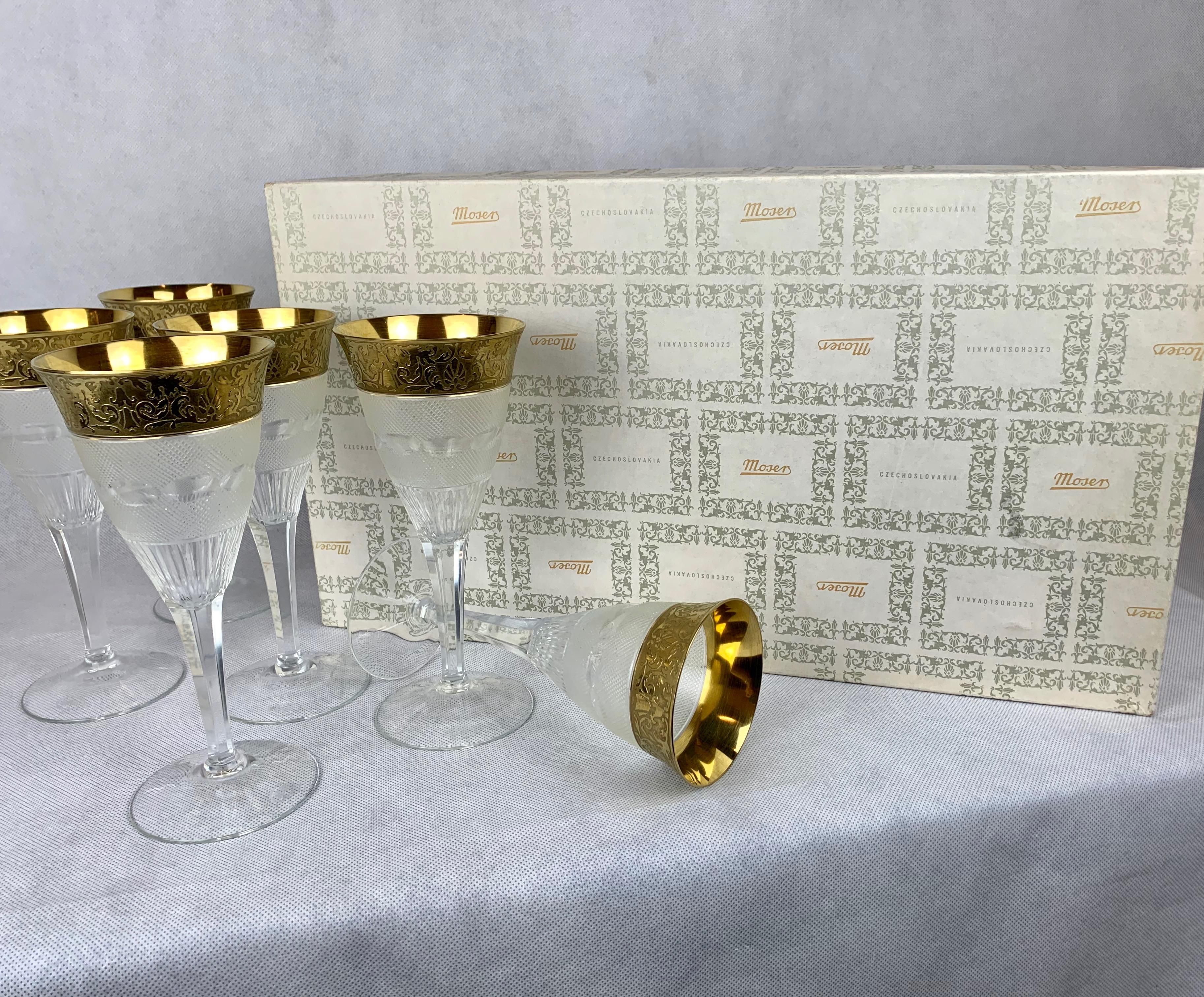 Set of six crystal Moser wines in the splendid pattern. Originally designed in 1911 and quickly became the Magnum Opus of Moser's patterns. The crystal body is diamond crosscut by hand with an engraved gold border. This pattern was also commissioned