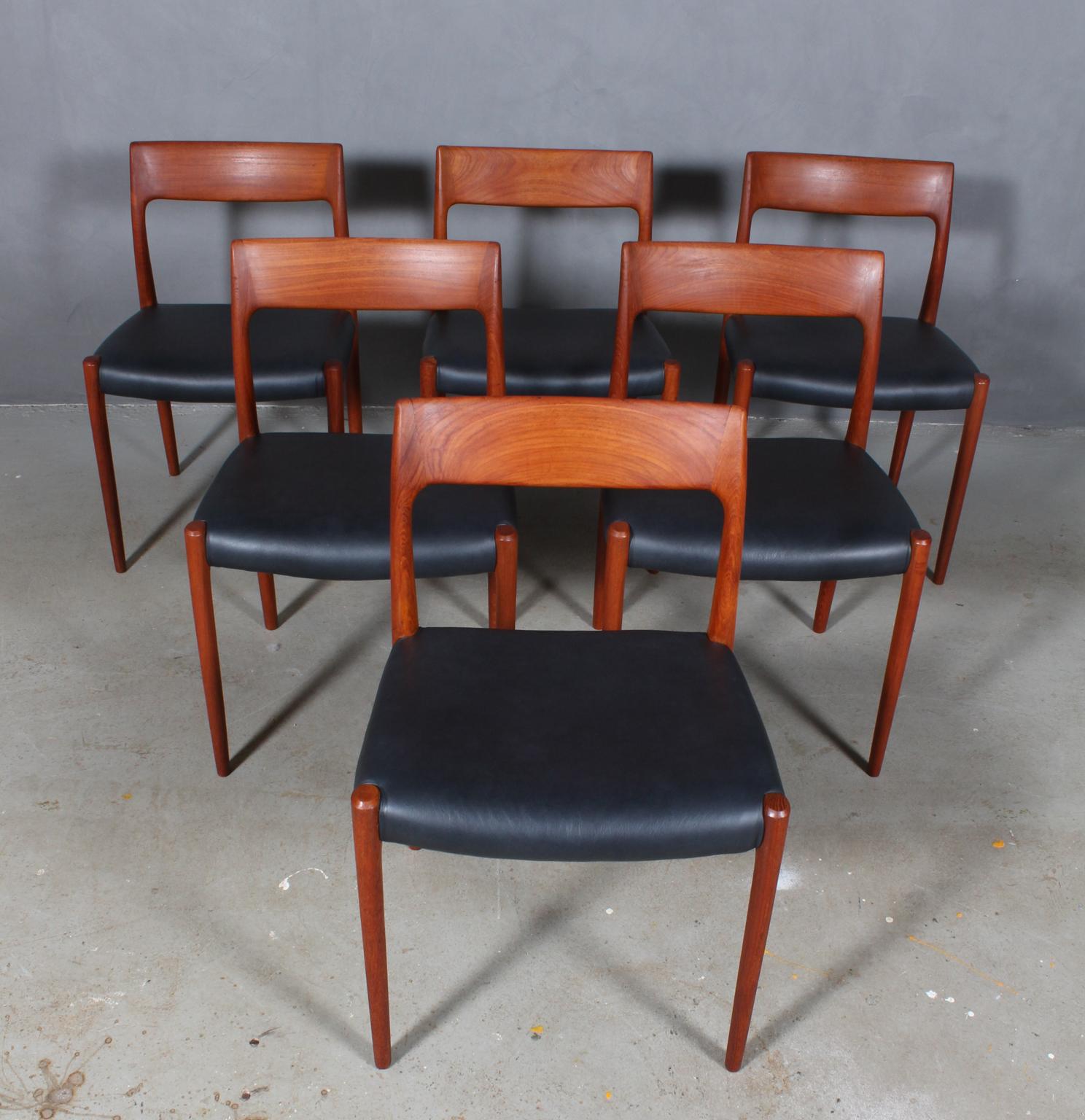Set of six N. O. Møller dining chairs with frame of solid teak.

Seats new upholstered with black aniline leather

Model 77, made by J. L. Møller, Denmark, 1960s.