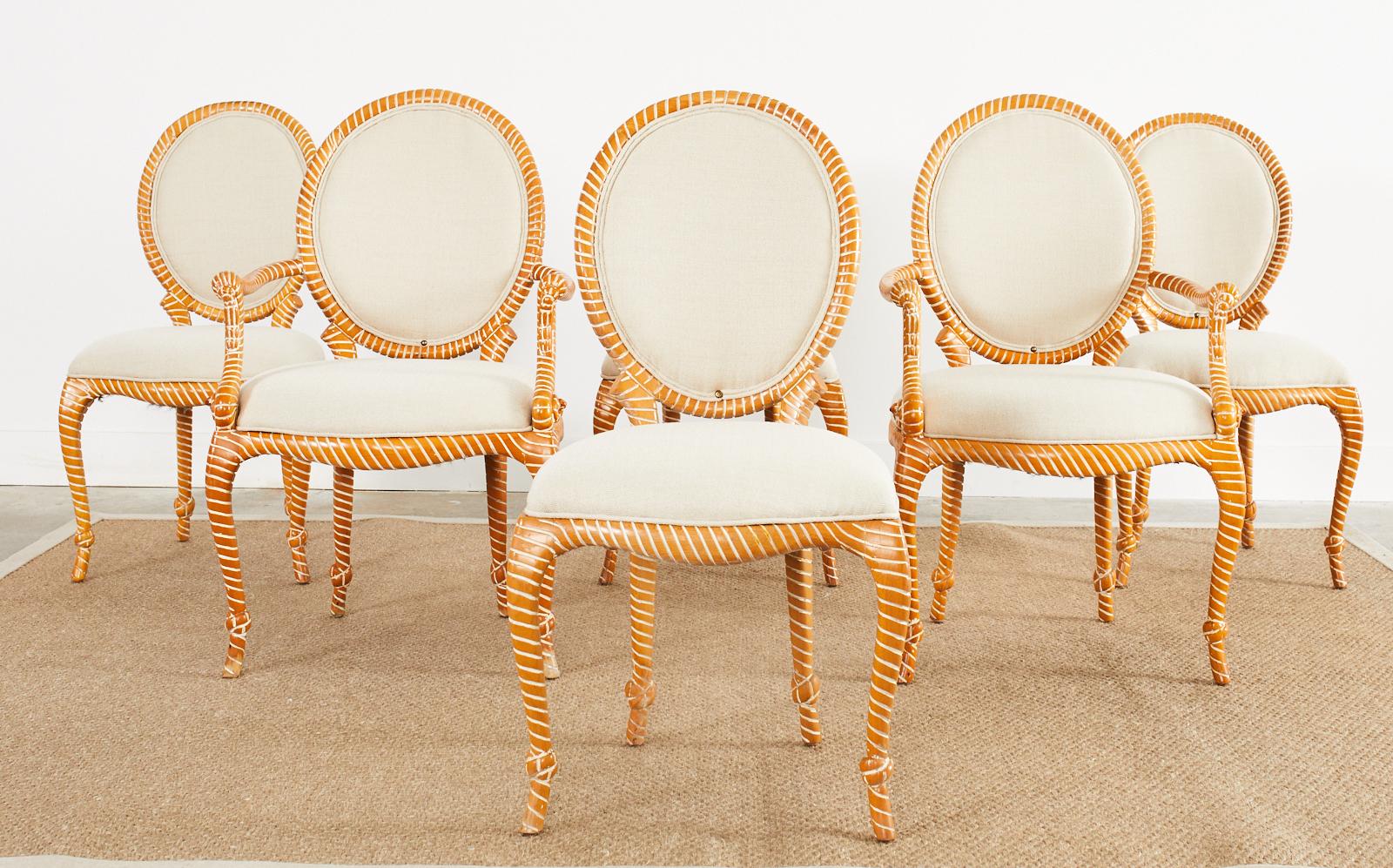 Amazing set of six hand-carved faux rope Spanish dining chairs made in the Napoleon III taste. The set consists of four side chairs and two host armchairs measuring 23.5 inches wide at the arm and 26 inches deep. The frames feature rope motif detail