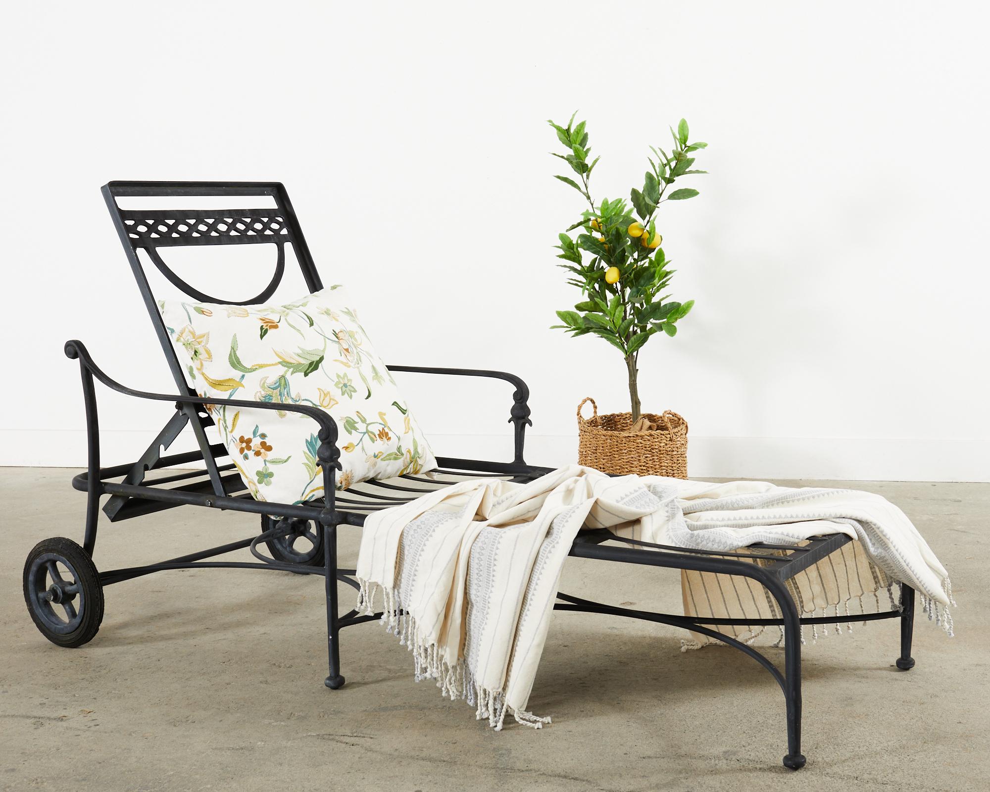 Stylish set of six cast aluminum patio and garden chaise lounges or longues made in the neoclassical taste. The lounges feature a black powder coated finish with an adjustable 3 position back. The generous sized lounges have gracefully curved arms