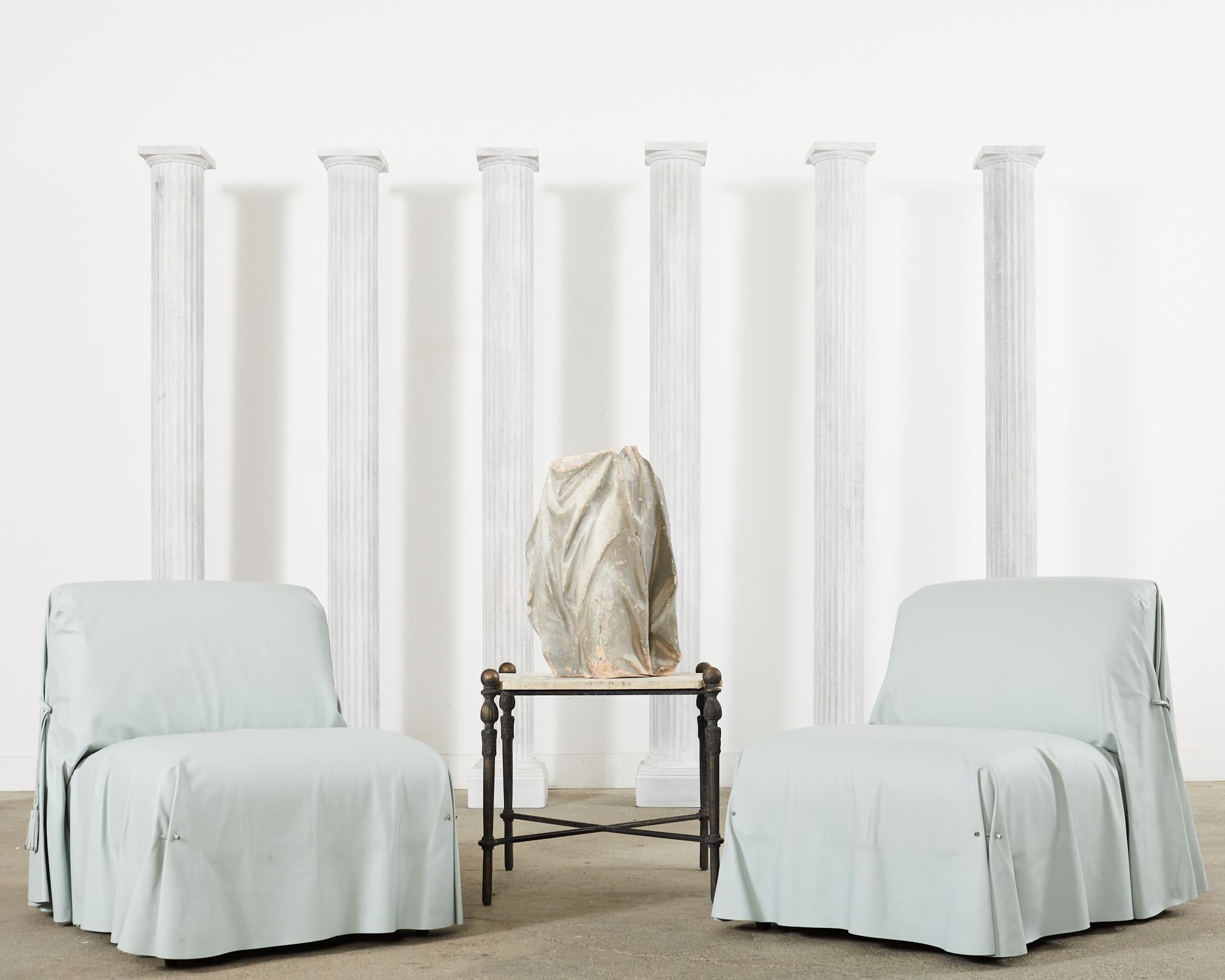 Imposing set of six matching zinc metal columns made in the Greco-Roman neoclassical style. The columns feature a slender fluted shaft with simple capitals in the doric taste. Handsome profile crafted from zinc metal with an intentionally distressed