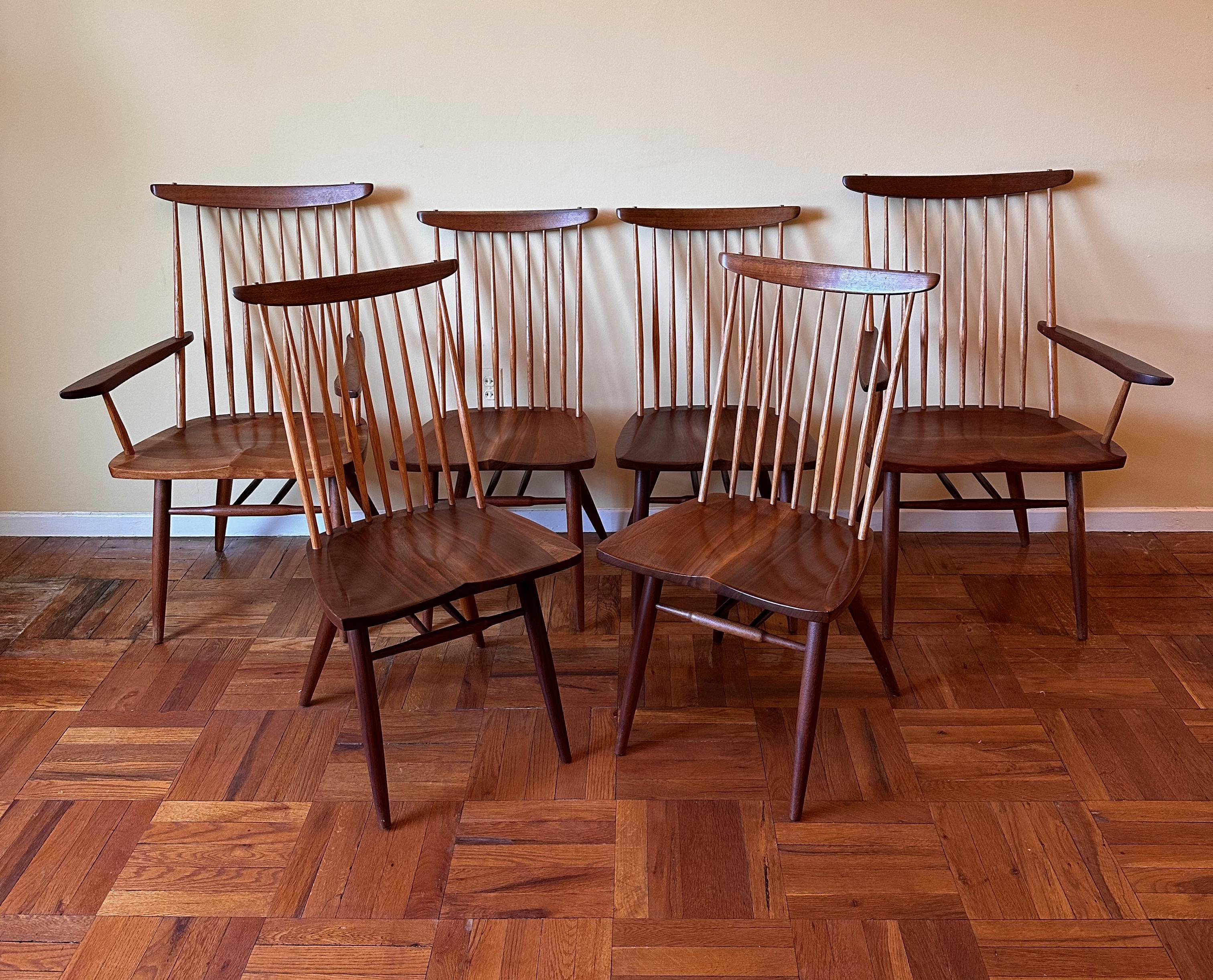 
Iconic design by master woodworker/artist George Nakashima. The New chair was debuted in 1956, this set, from 1978 includes two armchairs and four side chairs. These chairs are being sold by the original owner and are matched with an 8