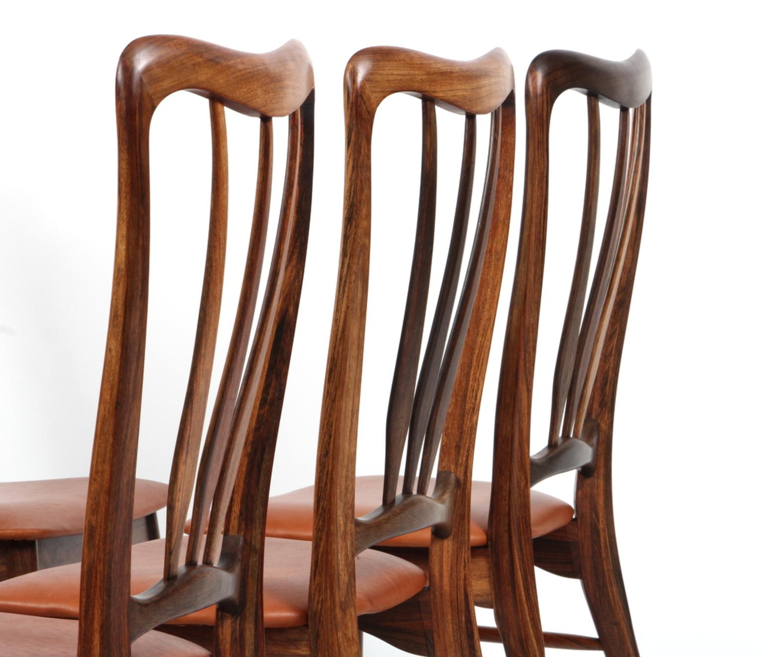 Set of six Niels Koefoed dining chairs in rosewood.

New upholstered with cognac aniline leather.

Made by Koefoeds Møbelfabrik.