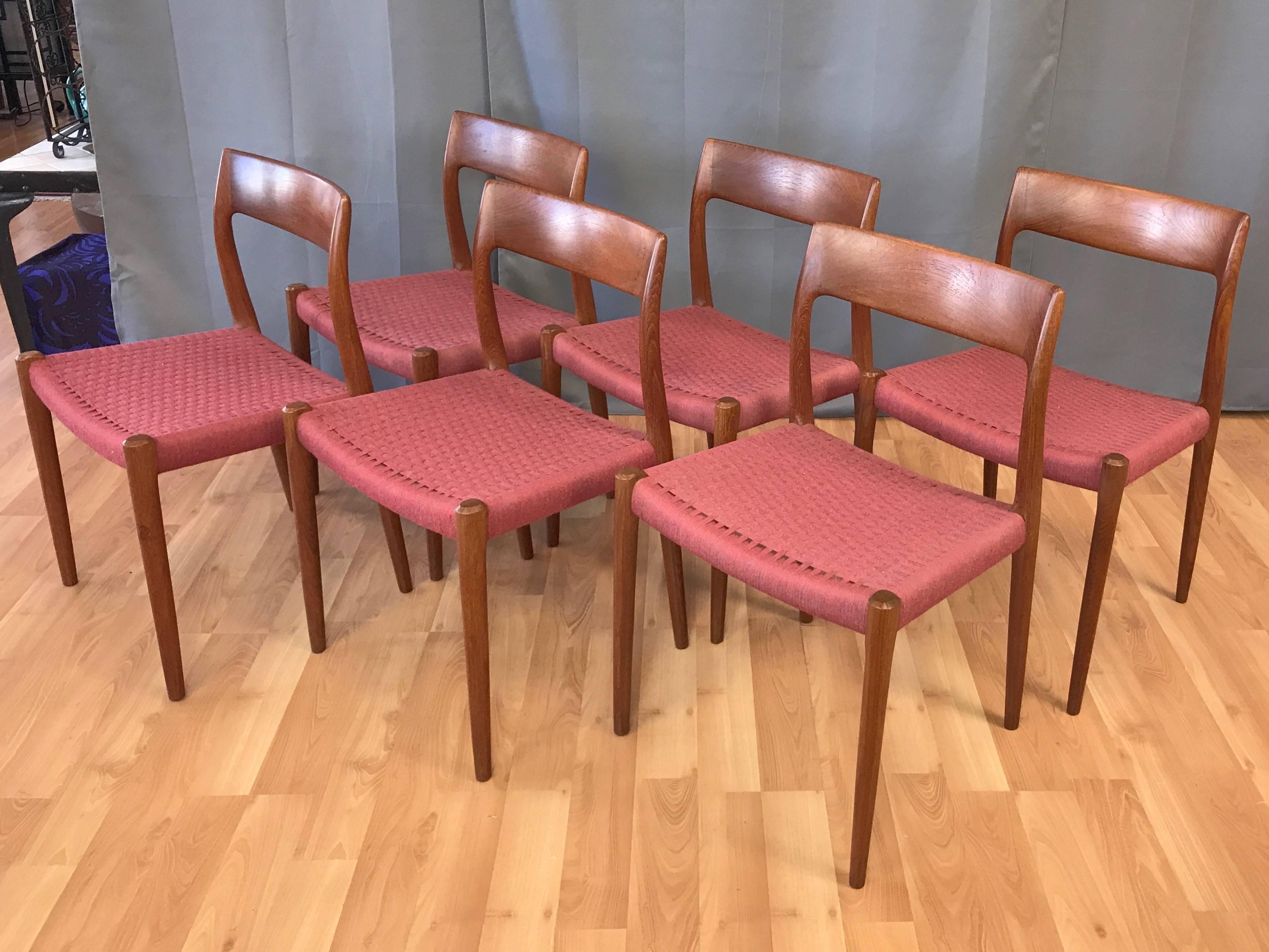 An especially handsome set of six model 77 teak dining chairs with original woven wool seats designed in 1959 by Niels Otto Møller for J.L. Møllers Møbelfabrik.

Solid teak frame displays quintessential Danish modern design and craftsmanship, from