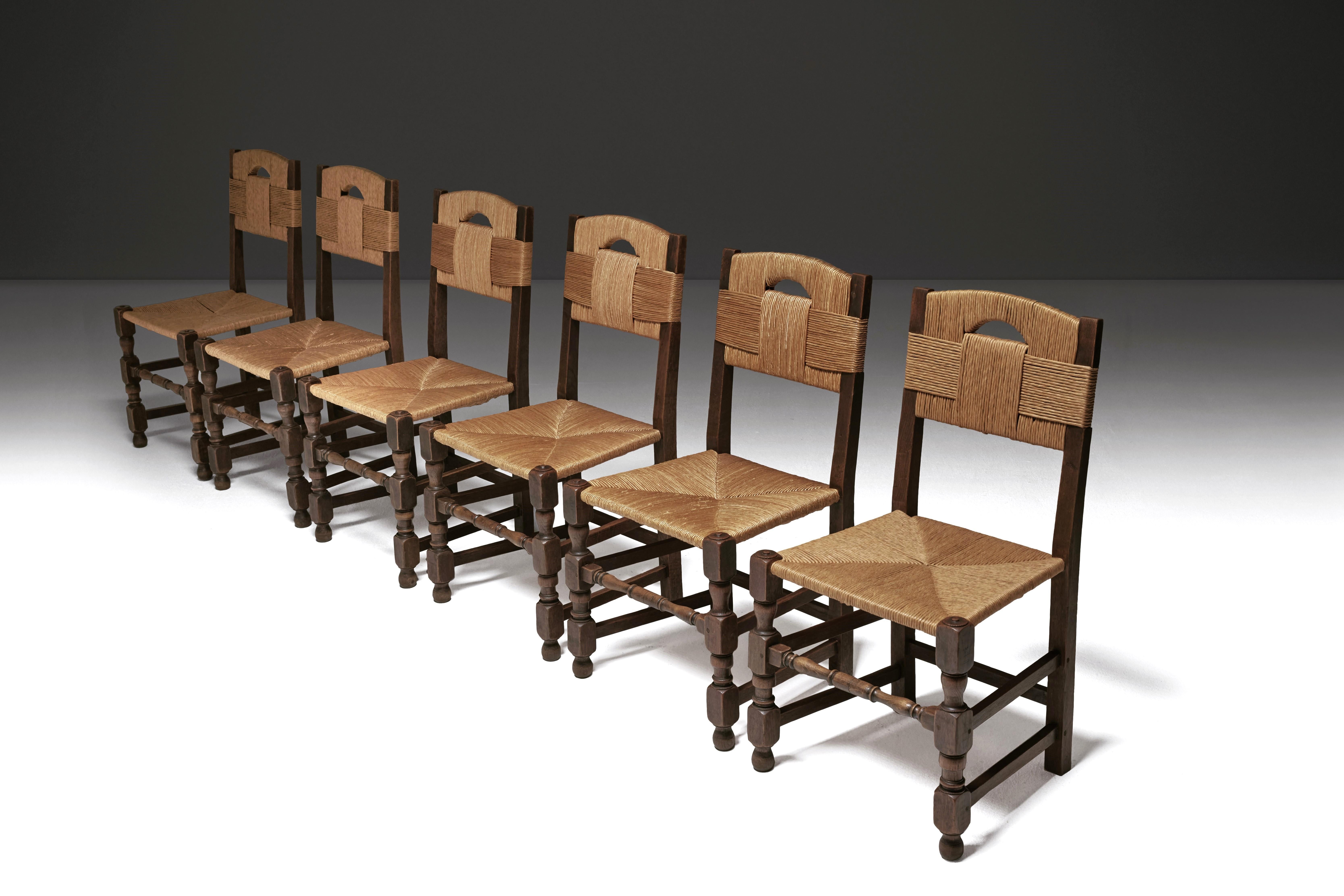 This exquisite mid-century dining set from the 1940s effortlessly merges historic charm with modern, organic design. Crafted from natural materials using traditional techniques, these chairs offer a timeless aesthetic that captivates the eye.

The