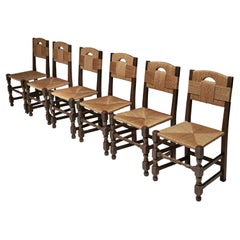 Juego de seis sillas de roble y junco con patas escultóricas, Europa Década de 1940