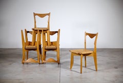 Juego de seis sillas "Thibault" de roble y junco de Guillerme & Chambron Francia Años 60