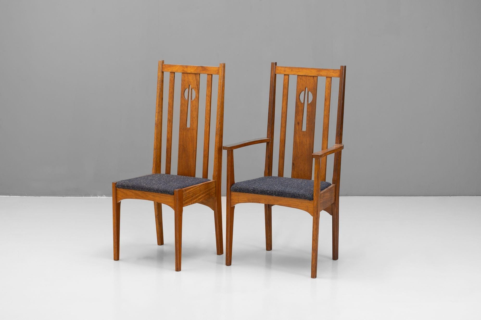 Set of six mid-century high back dining chairs in a Charles Rennie Mackintosh style. Re-finished and re-upholstered. Wear consistent with age and use. U.K circa 1950.

With Arms H 109cm (SH 47cm) x W 57cm x D 49cm - Without Arms H 108 cm (SH 47cm) x