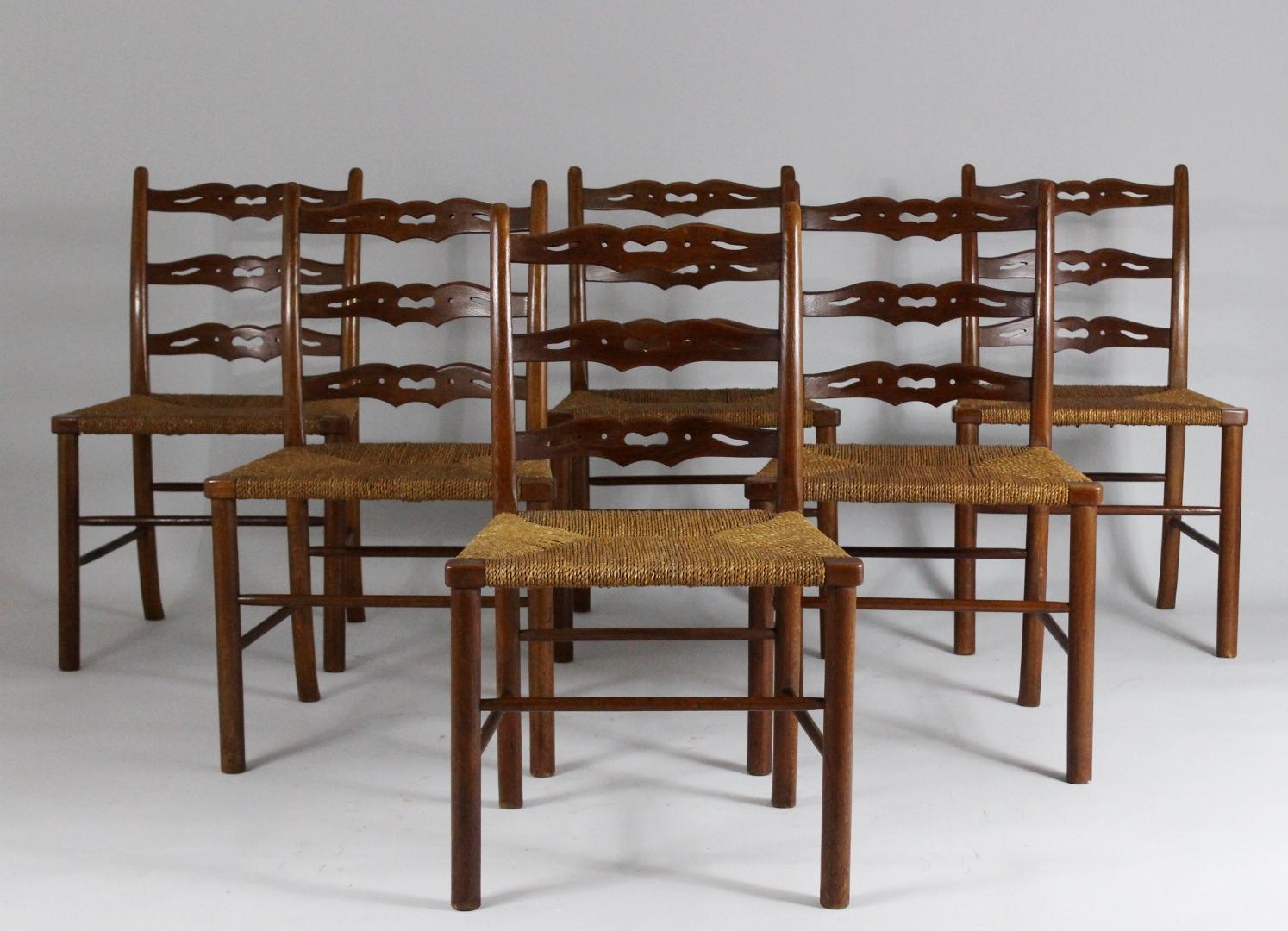 Set of six oak dining chairs with woven rush seat. They have been originally placed in a small hunting chateau in Silesia, Czech republic. Chairs are in very good original condition with nice patina.