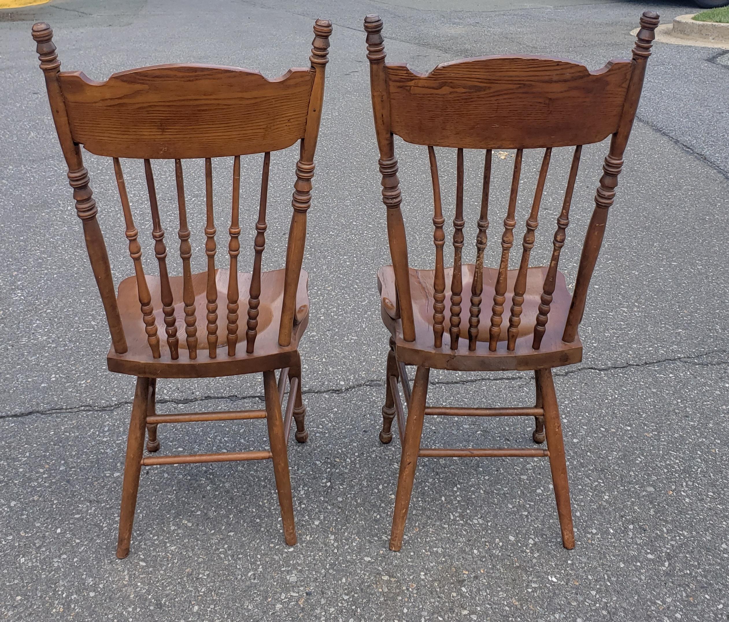 Set of Six Oak Pressed and Spindle Back Saddle Seat Dining Chairs In Good Condition In Germantown, MD