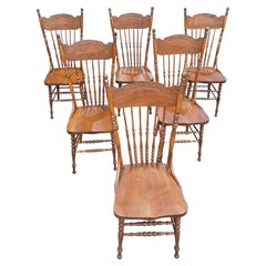 Set of Six Oak Pressed and Spindle Back Saddle Seat Dining Chairs