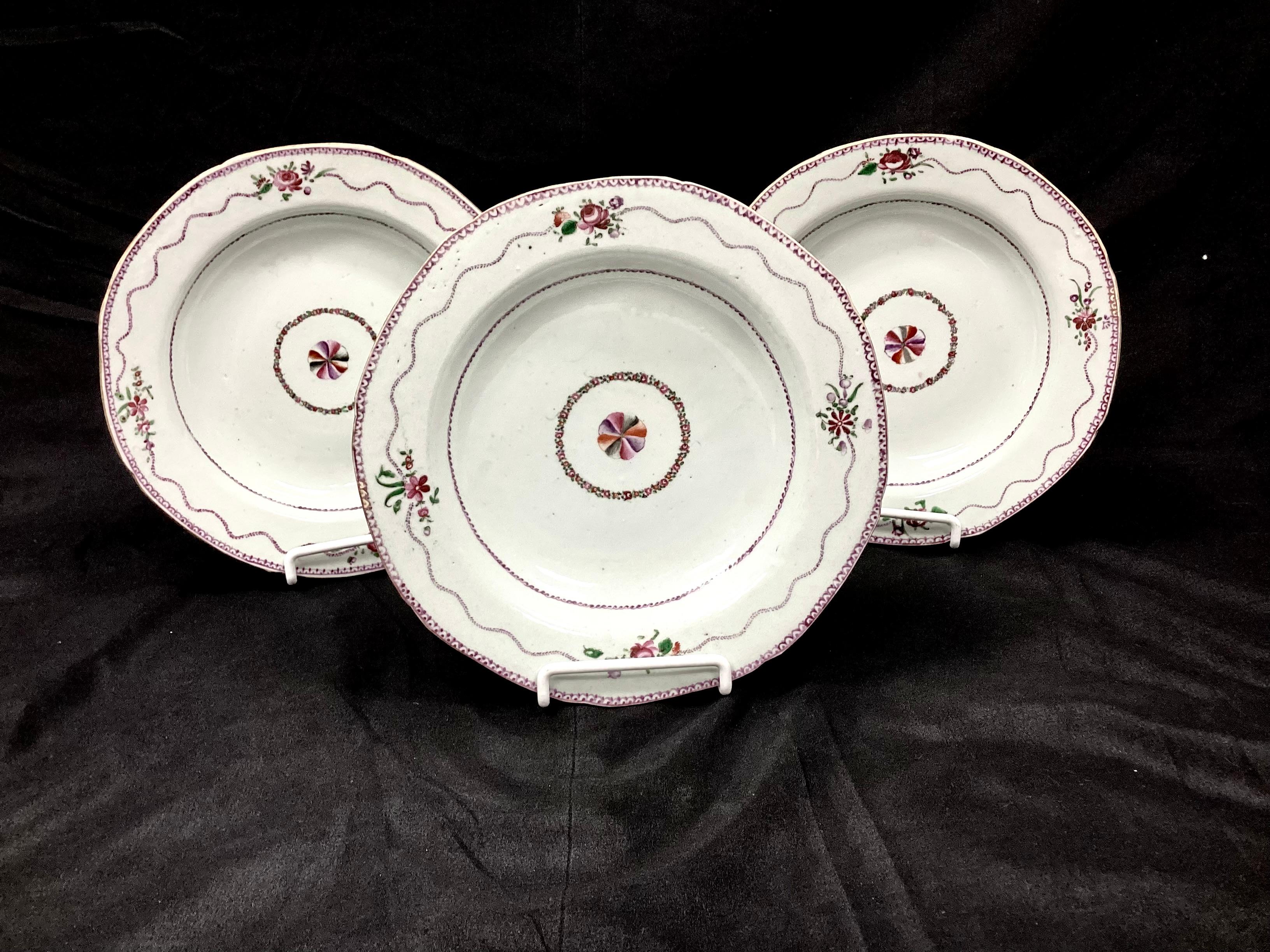 Set of six 19th century Chinese Export porcelain bowls. Bowls are hand-painted with florals with central flower surrounded by garland. Features purple, green and white colors. 