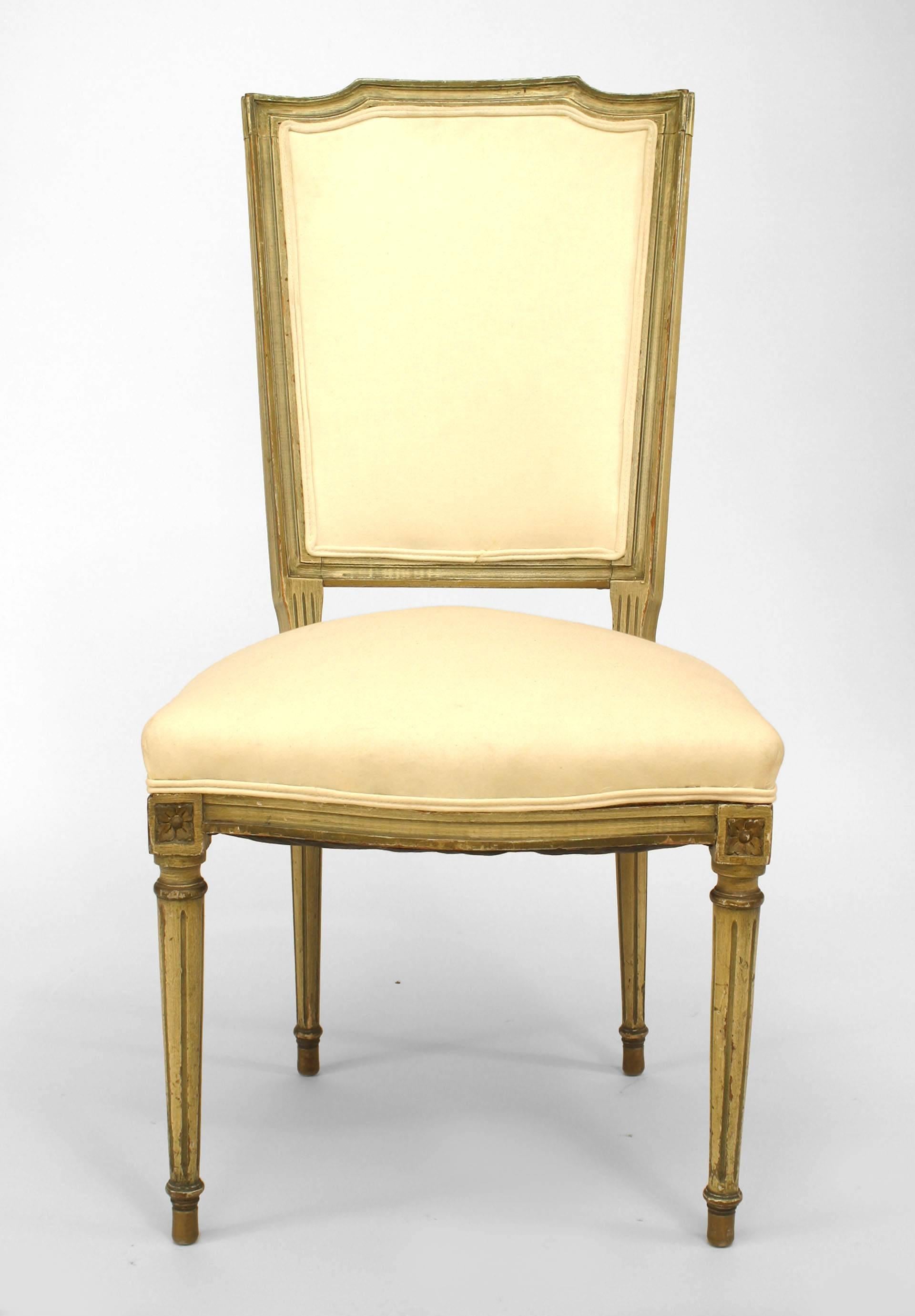 Set of six of French Louis XVI style (20th century) light green painted side chairs with muslin upholstered seat and back.
  