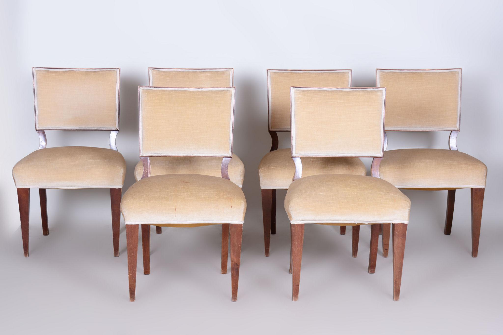 Six Art Deco chairs

Origin: France 
Period: 1920-1929
Material: Walnut, upholstery

In pristine original condition, the upholstery has been professionally cleaned, and its polish revived by our refurbishing team in Czechia. 							

It has been