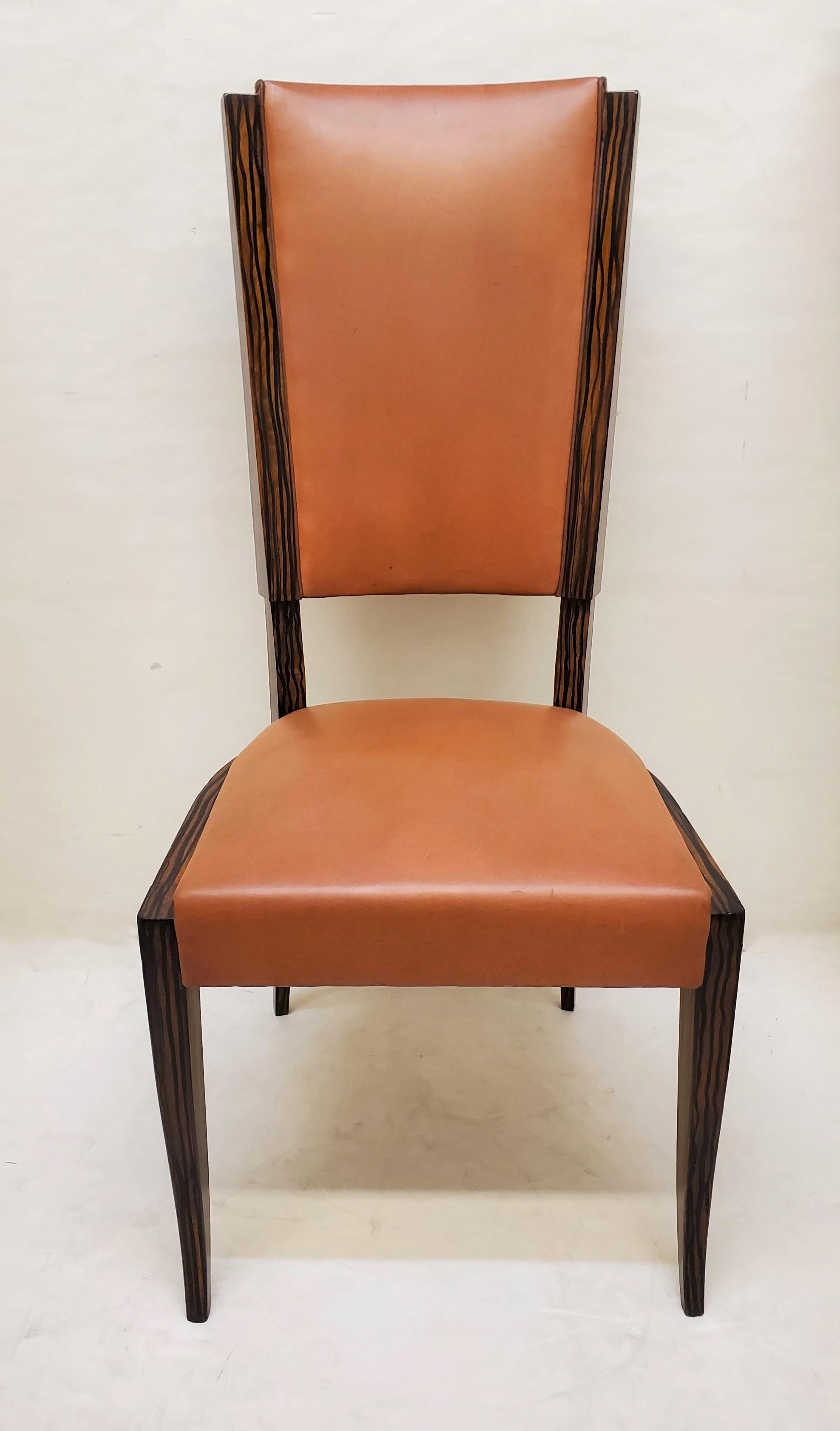 A beautiful set of six original French Modernist tall back, faux macassar dining / side chairs. Tall elegant backs with stepped linear top crest and angular shaped lower backrest, featuring elegant tapering cabriole front legs and slightly tapered