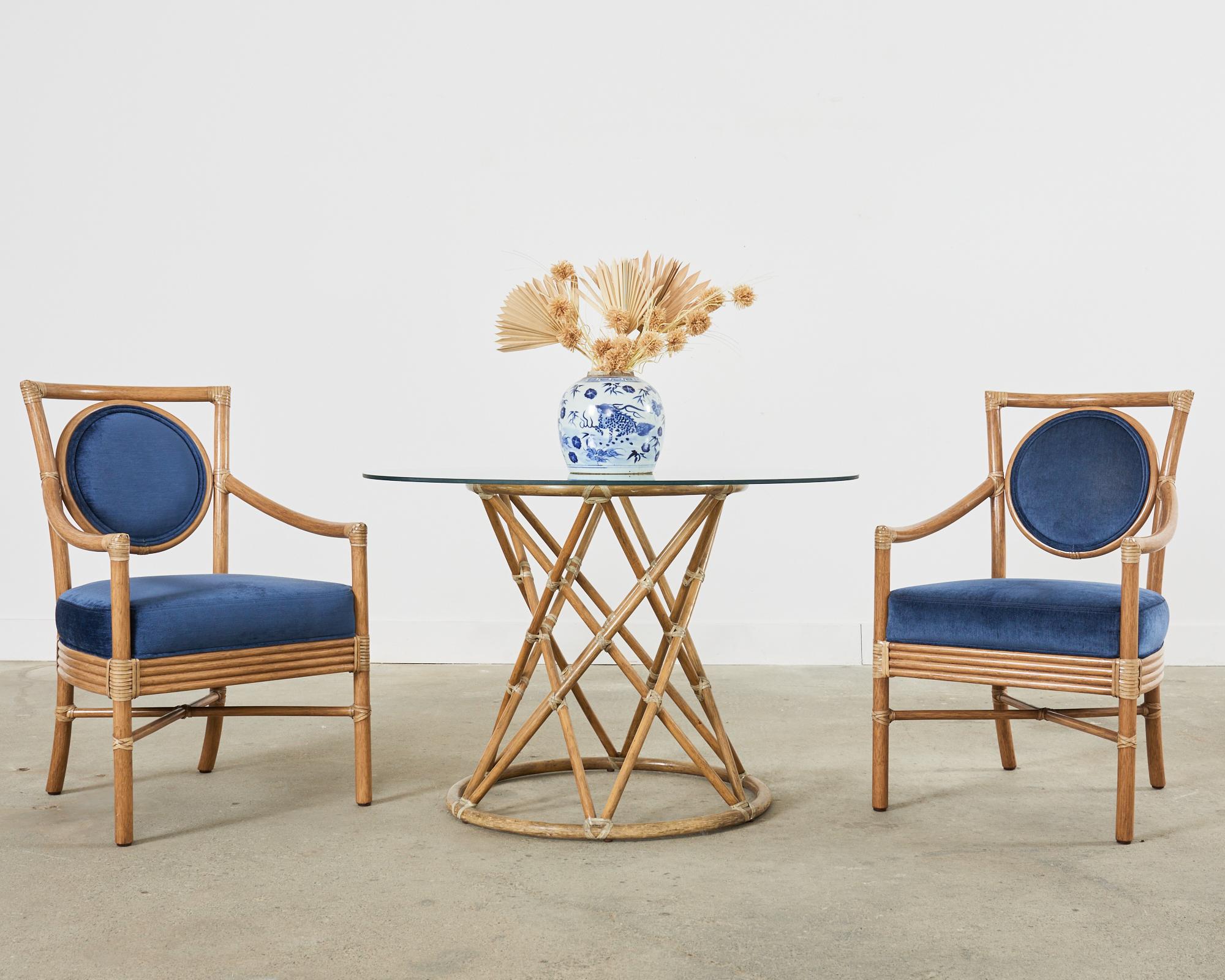 Stately set of six rattan salon armchairs or dining chairs ( Model # MCM222B) made in the coastal organic modern style by McGuire. These rare chairs were designed by Orlando Diaz-Azcuy and feature an imposing square pole rattan frame contrasted by a