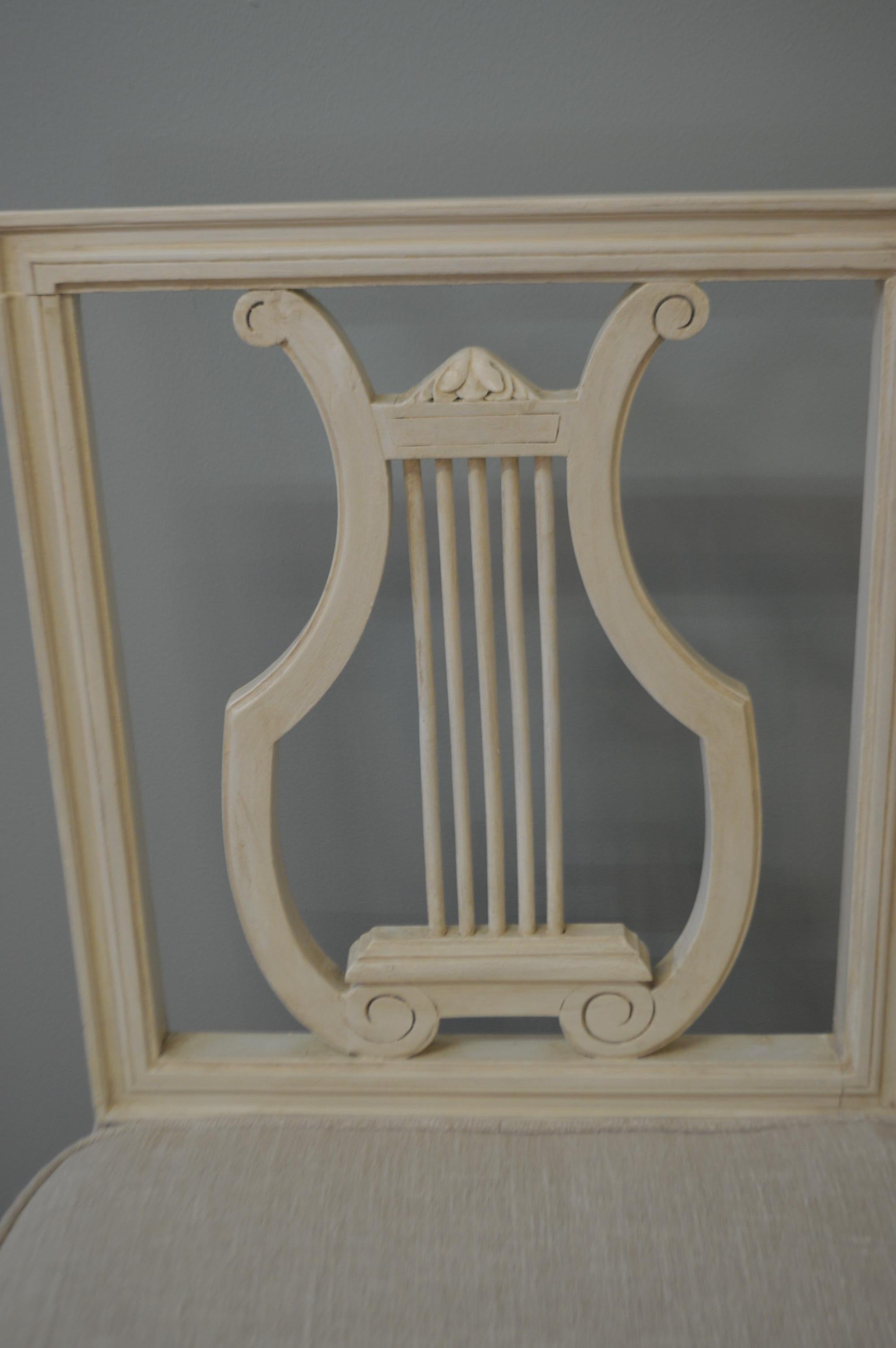 Set of six lyre back dining chair painted in light cream color with caned seat, the cane is in excellent condition. We had six removable linen seat cushions custom-made, they attached to the back with velcro and the fabric can be removed for