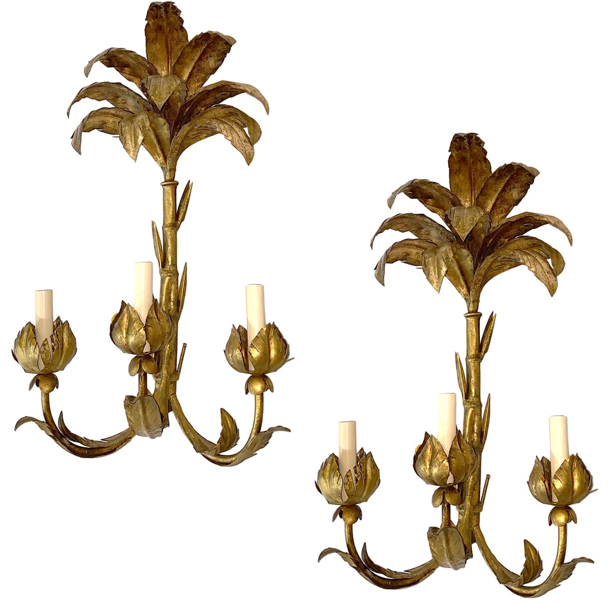 Set of four large Italian gilt metal palm frond-shaped sconces with 3 lights each with original patina. Sold in Pairs.

Measurements:
Height: 23