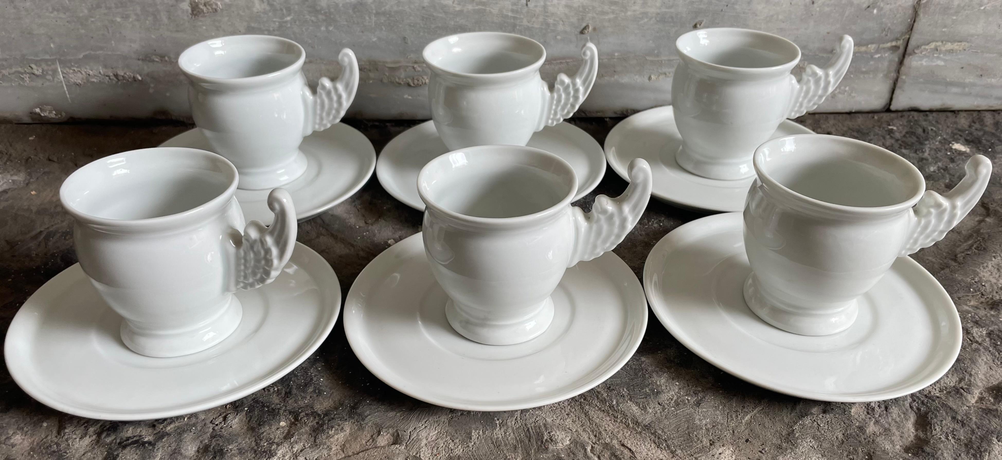 Set of six Paris Porcelain angel wing cups. Vintage set of six large cups and saucers of classical  baluster form with projecting winged handles; stamped Limoges under saucers perfect for coco or breakfast cappuccino. France, first quarter of 20th
