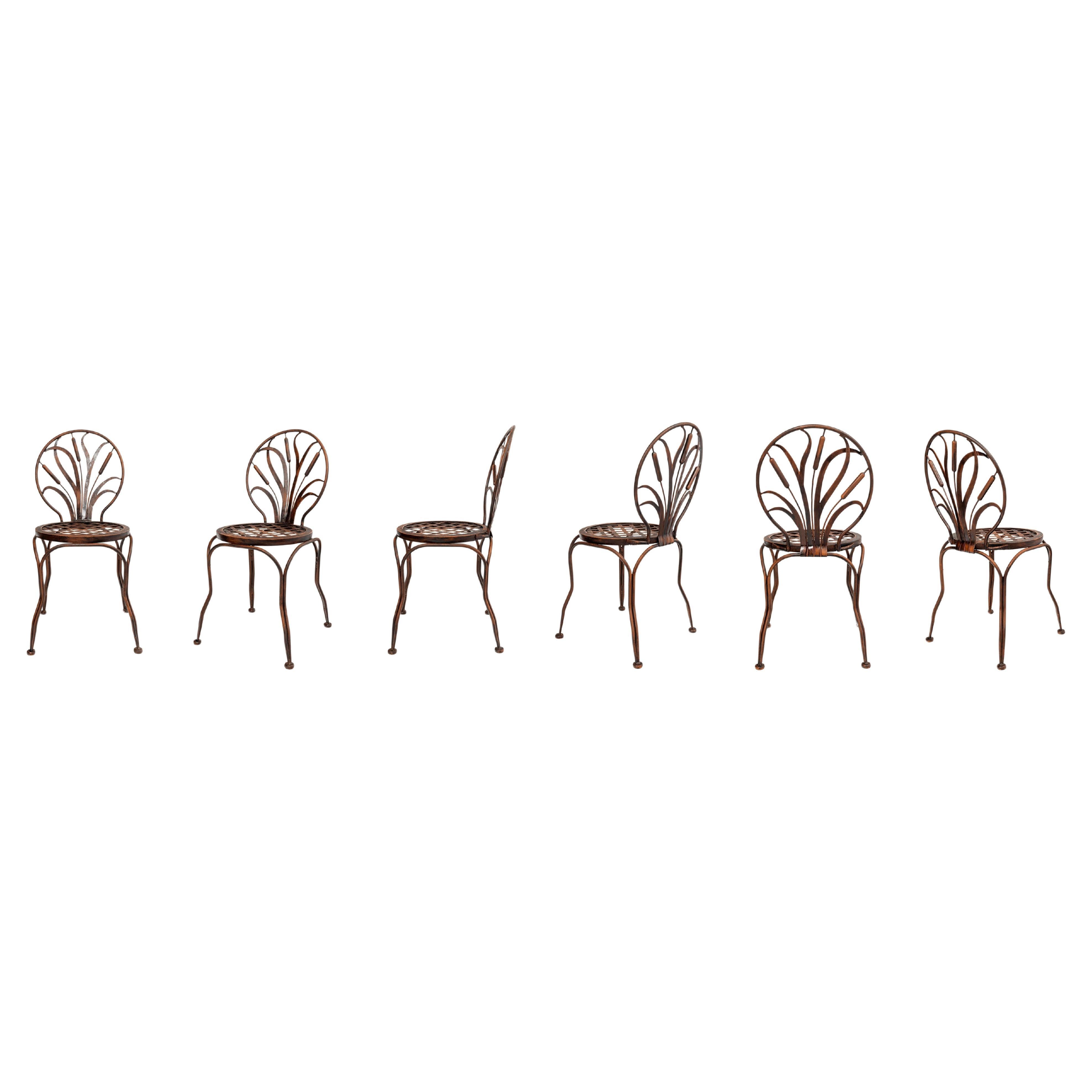 Set of six patinated wrought iron chairs, France, late 19th century.