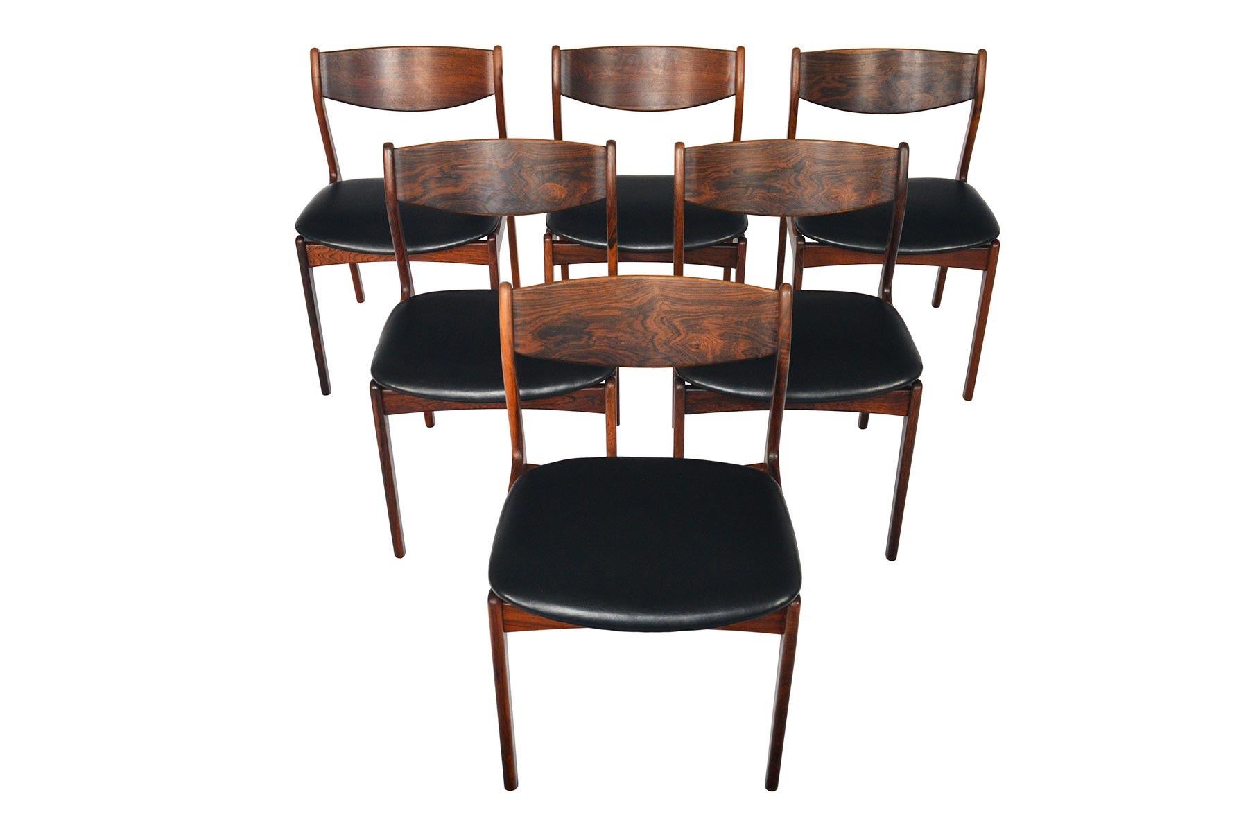 This set of six Danish modern midcentury dining chairs by P.E. Jørgensen for Farso Stolefabrik offer a Classic Scandinavian silhouette with a stately curved backrest. Crafted in Brazilian rosewood, this set provides comfortable seating for both